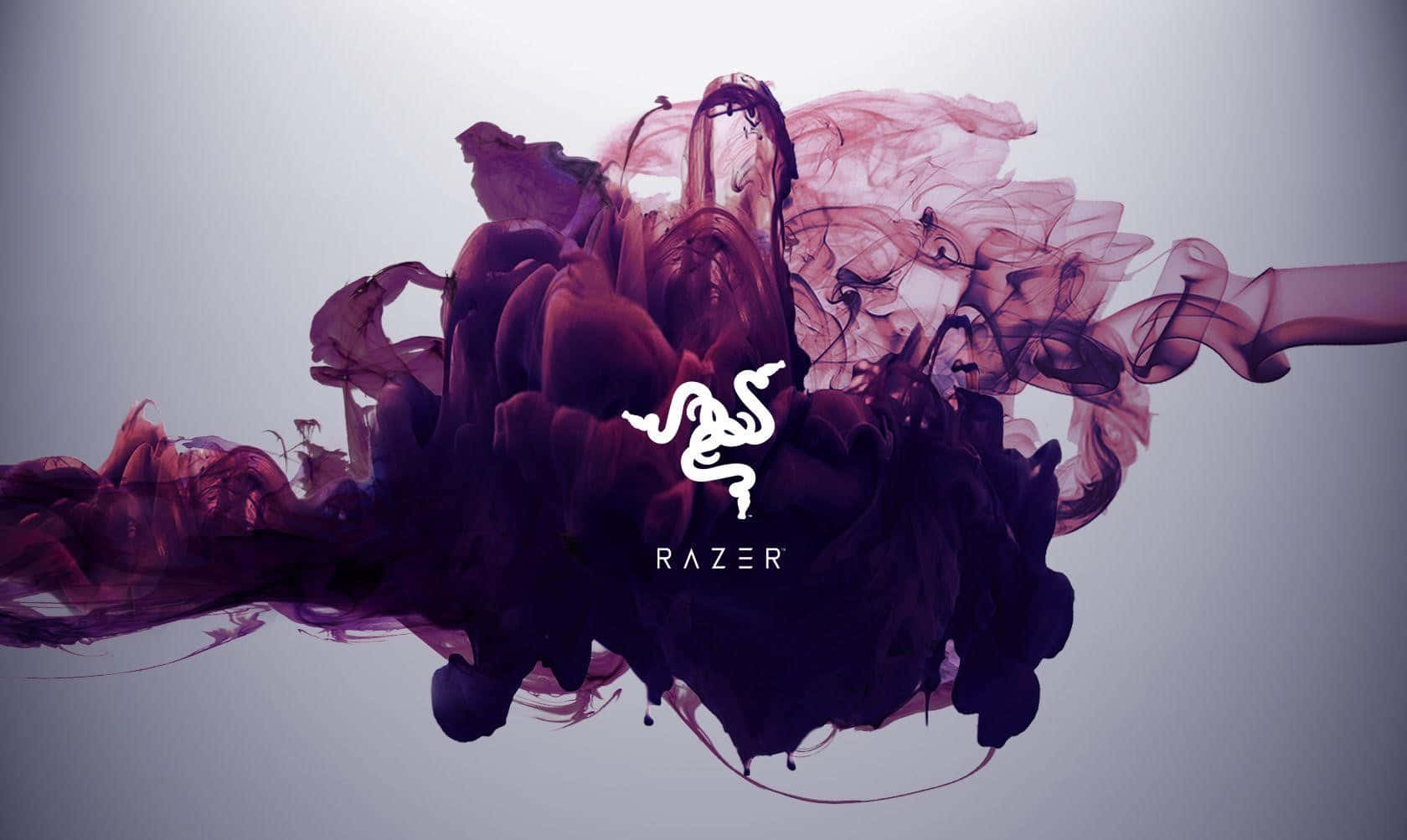 紫色和粉紅色的抽象墨水漩渦，中央有 Razer 標誌。