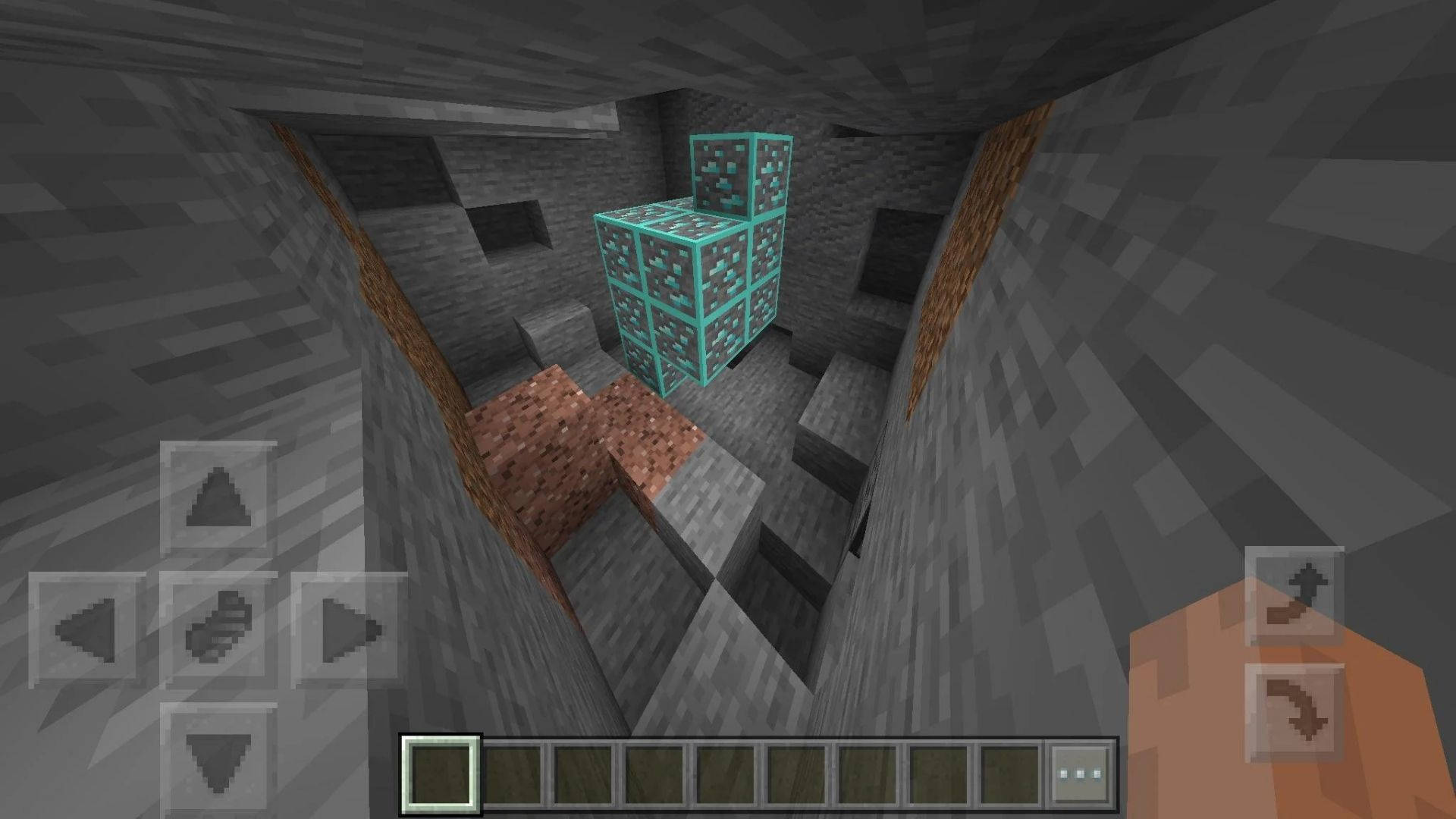 未被發現的 Minecraft 鑽石 壁紙 — Minecraft 洞穴內的第一人稱視角，發光的青色鑽石方塊堆疊在豎井中。