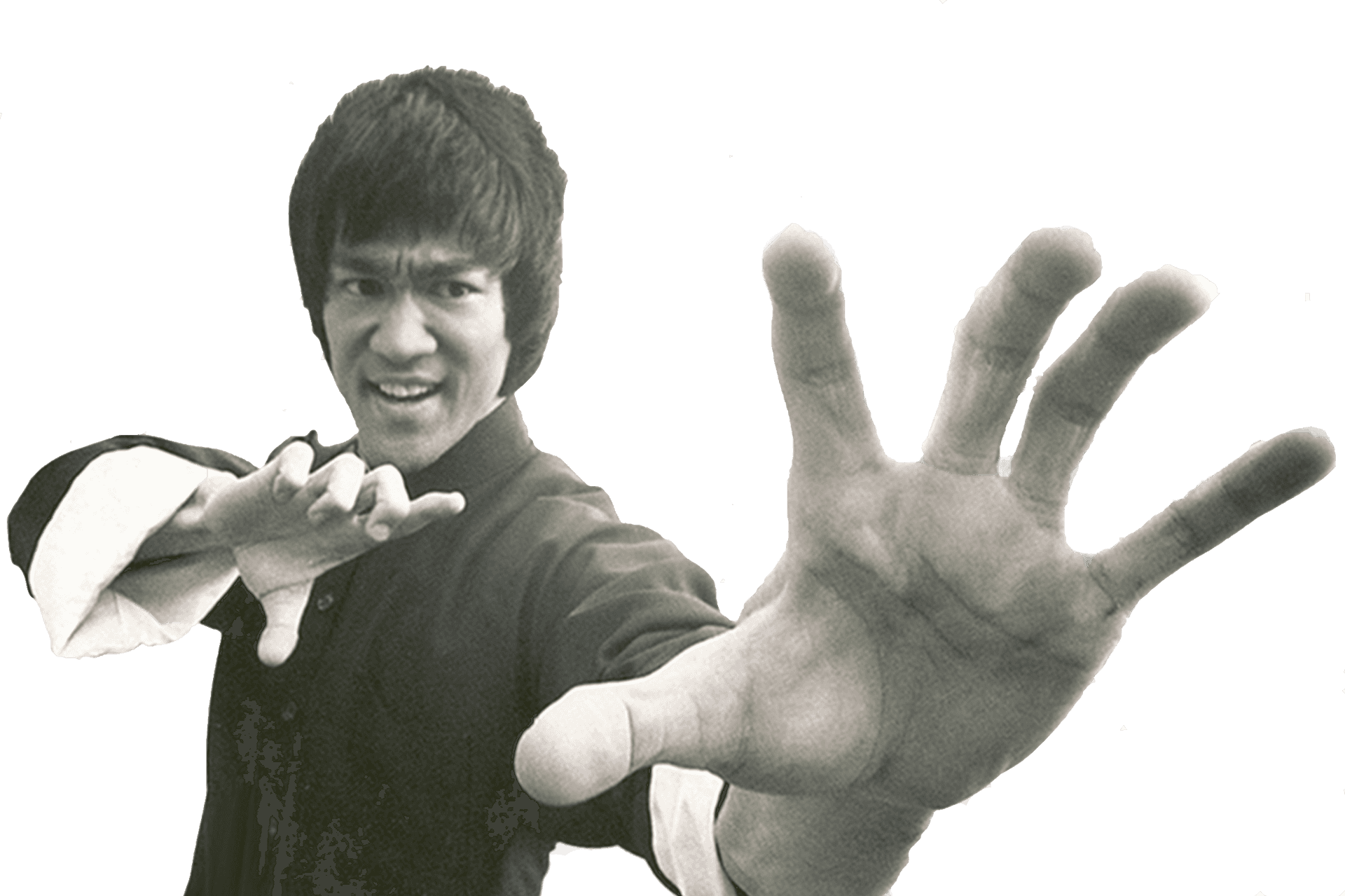 李小龍擺出武術姿勢，一隻手向前。