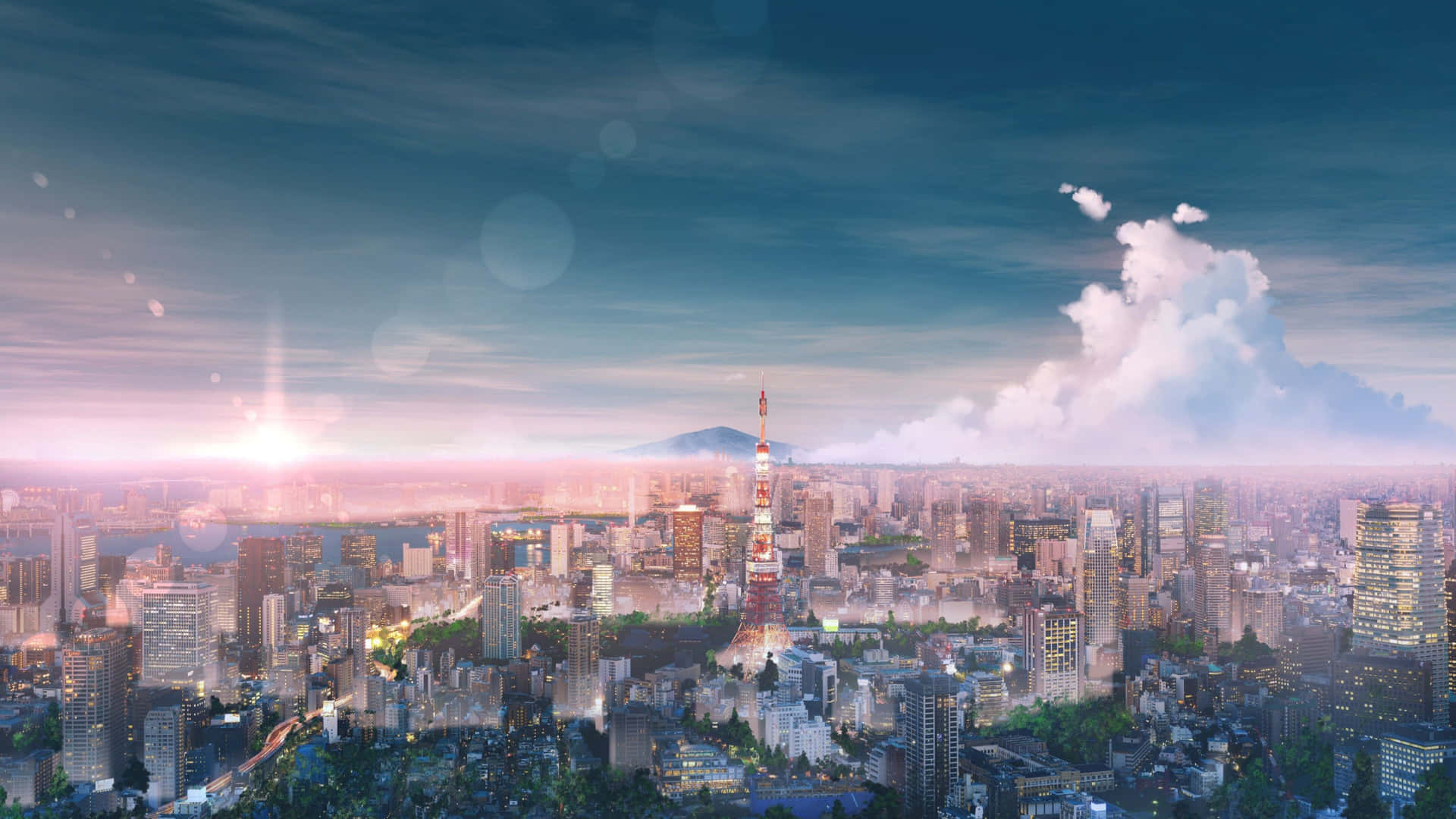 日落時分的東京天際線，東京塔被照亮，天空中有雲。