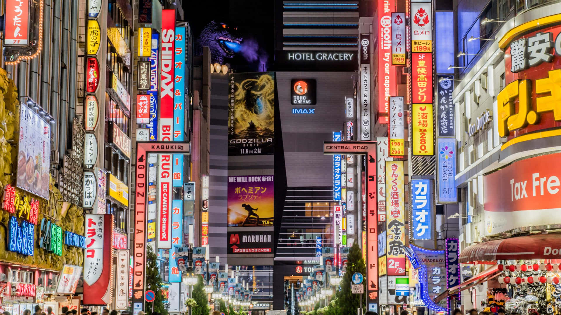 夜晚的東京街道，霓虹燈招牌和哥斯拉廣告閃閃發光。 — 哥吉拉 壁紙