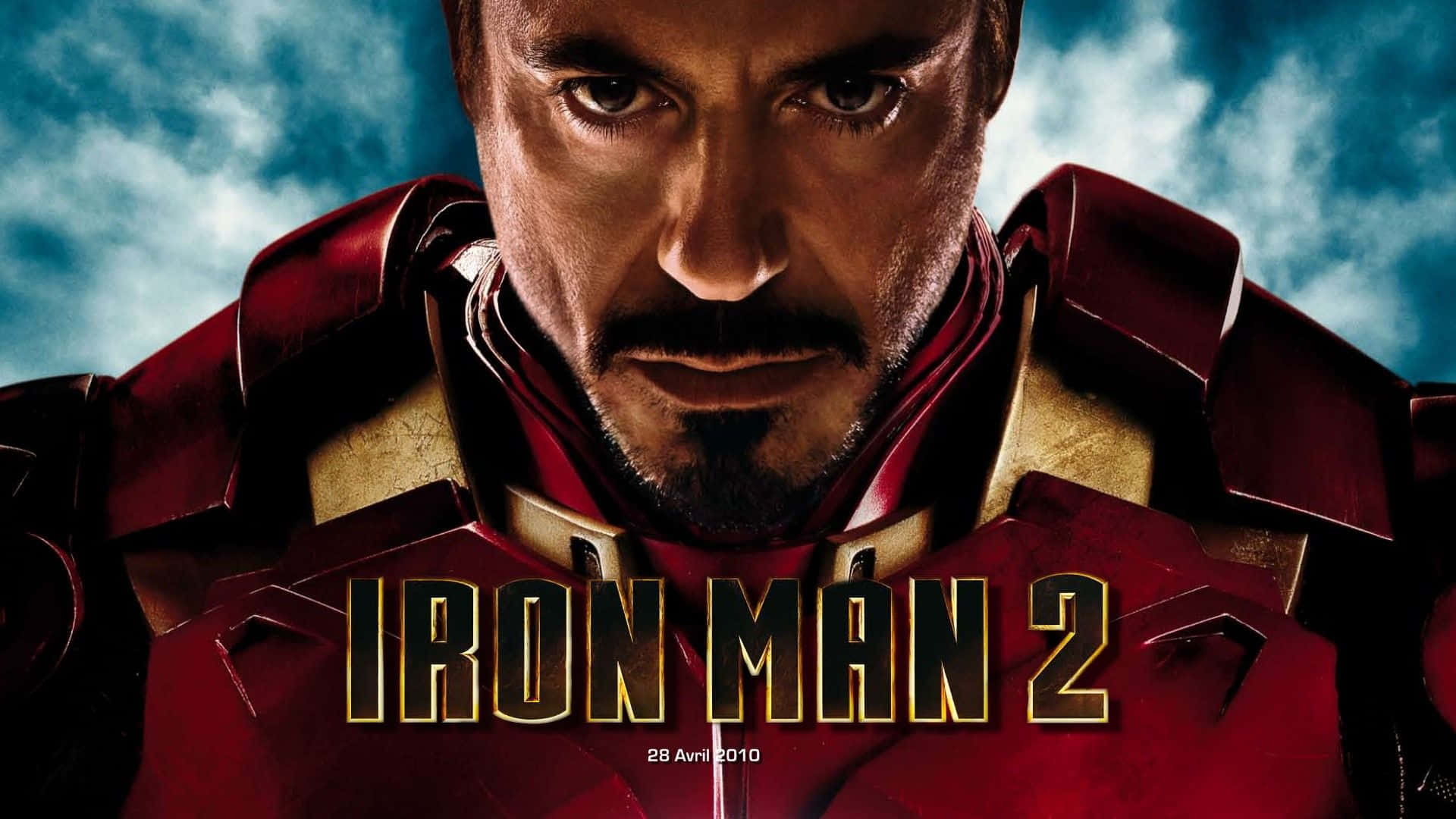 Iron Man Movies 桌布 壁紙 — 東尼史達穿上紅色和金色鐵甲奇俠盔甲的特寫，眼神銳利，背景是暴風雨的藍天。