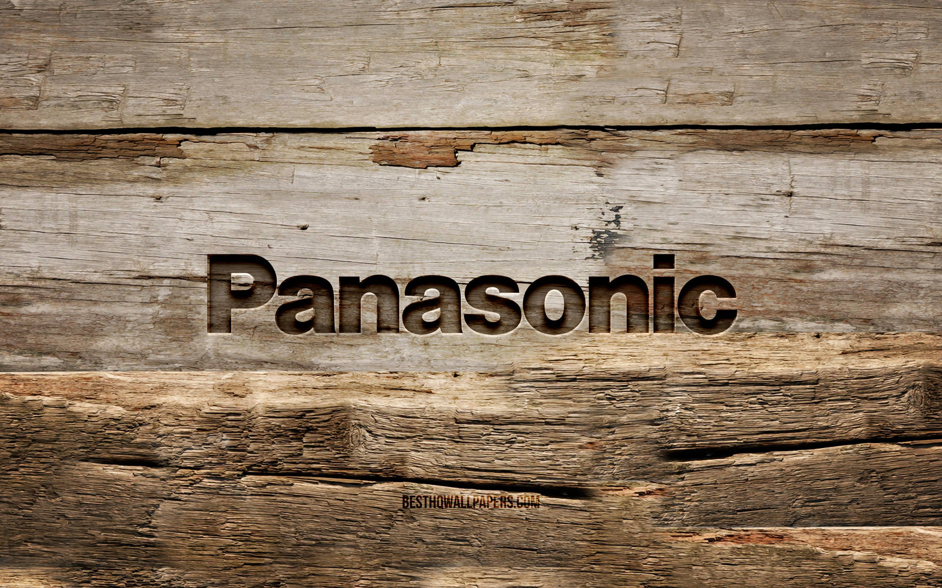 Panasonic 標誌在老化木表面上，可見木紋和磨損。