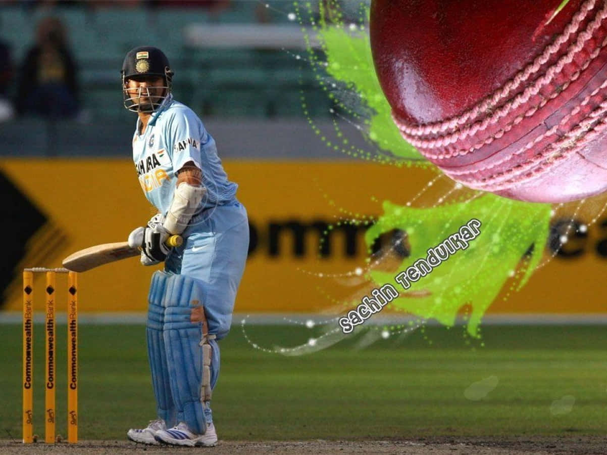 Sachin Tendulkar 桌布 壁紙 — 板球傳奇沙欽·坦杜卡身穿藍色制服，準備擊打一個帶有綠色能量爆發的巨大紅色球。