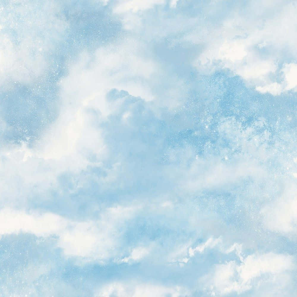 唯美雲朵 桌布 壁紙 — 柔和嘅粉藍色天空，充滿咗輕盈嘅白雲同精緻嘅閃爍粒子，輕輕飄動。