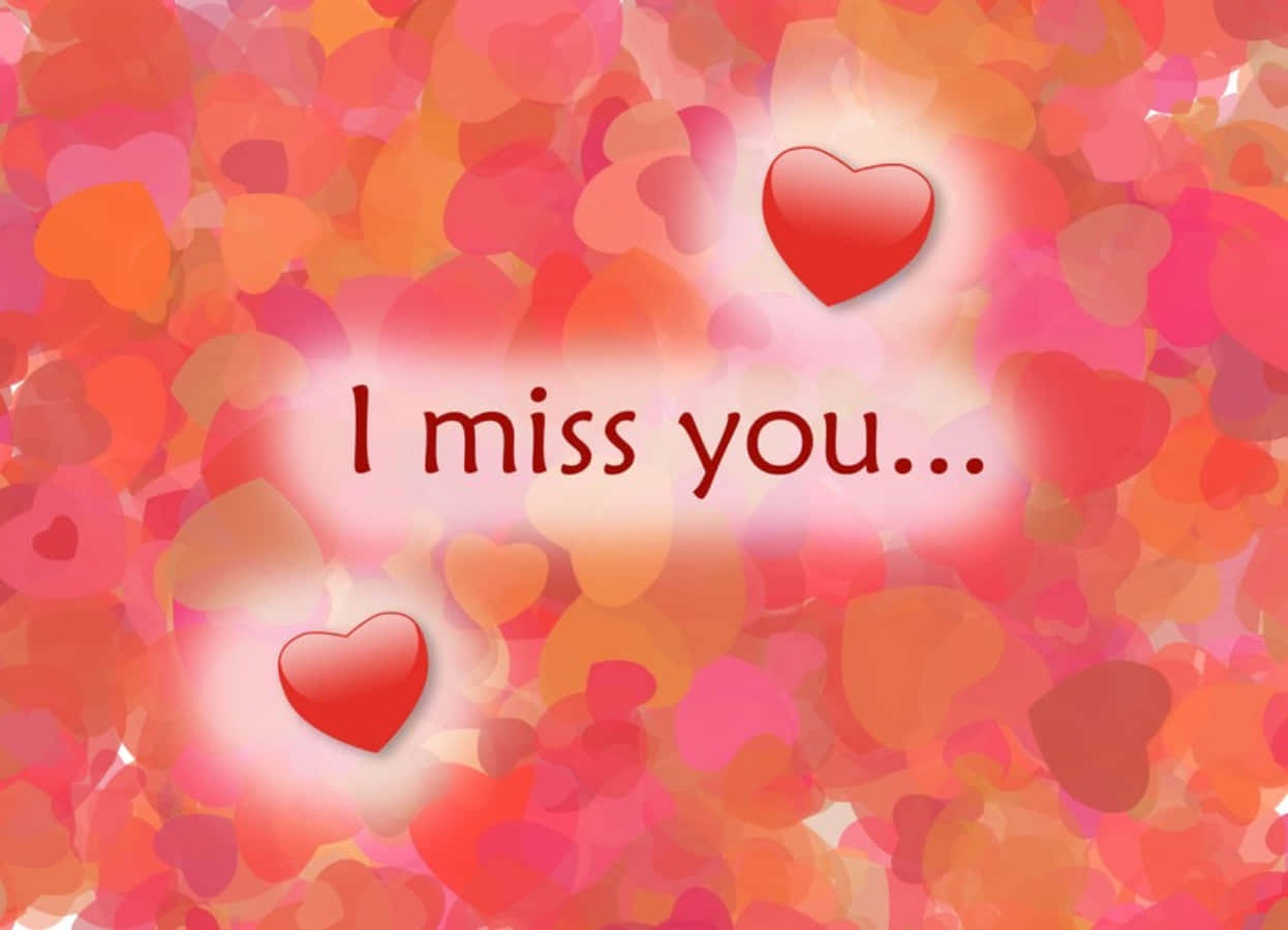 I Miss You 桌布 壁紙 — 柔和發光的心形背景，帶有漂浮的心形和文字「我想你...」，以溫暖的紅色調呈現。