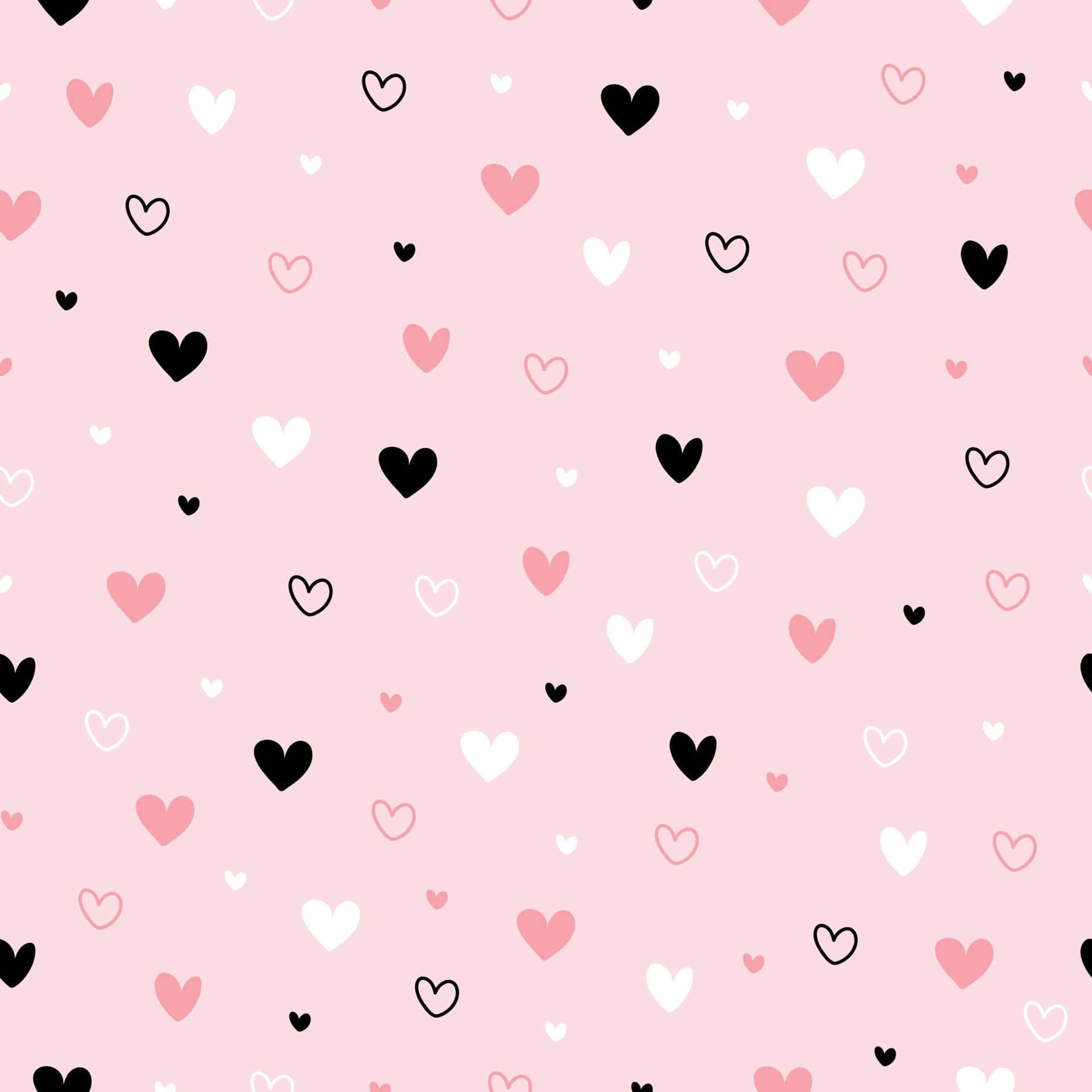 Cartoon Heart 桌布 壁紙 — 柔和的粉紅色背景，散落著黑色、白色和粉彩粉紅色的俏皮心形。