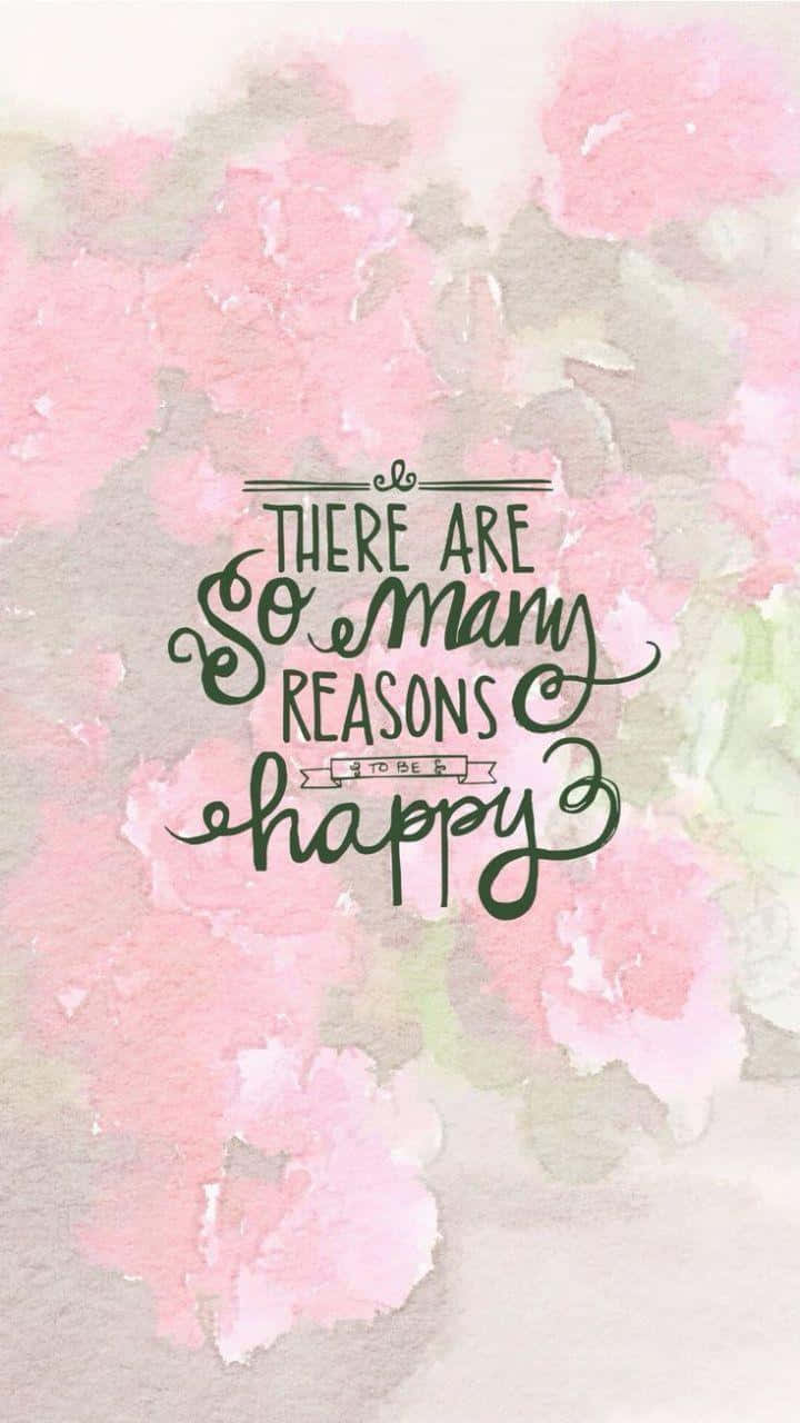 Spring Quotes 桌布 壁紙 — 柔和粉紅與綠色的水彩花卉背景，搭配優雅的深綠色書法字體，寫著「有太多理由要快樂」。