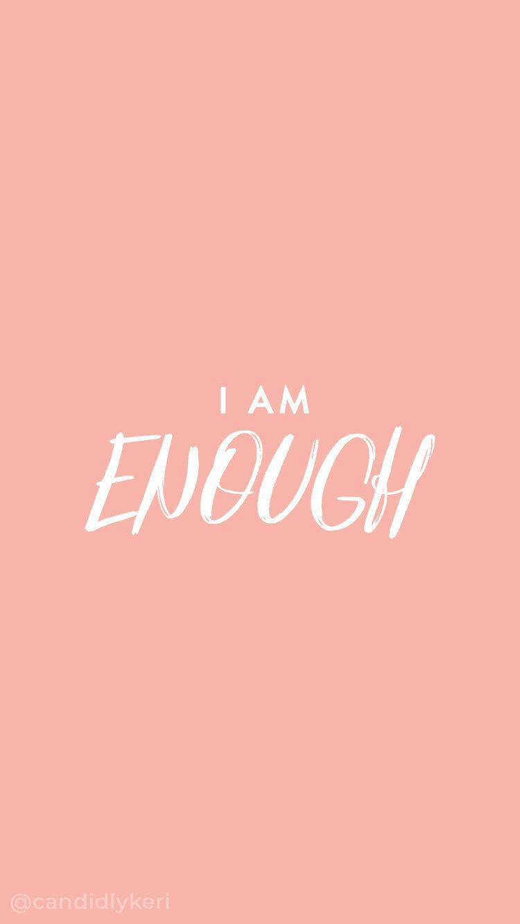 粉紅色背景上帶有白色文字 I AM ENOUGH，用於增強自信。