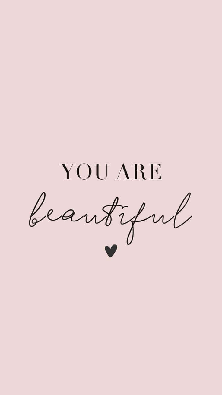 粉紅色背景，黑色文字寫著「You Are Beautiful」和一個小心形。