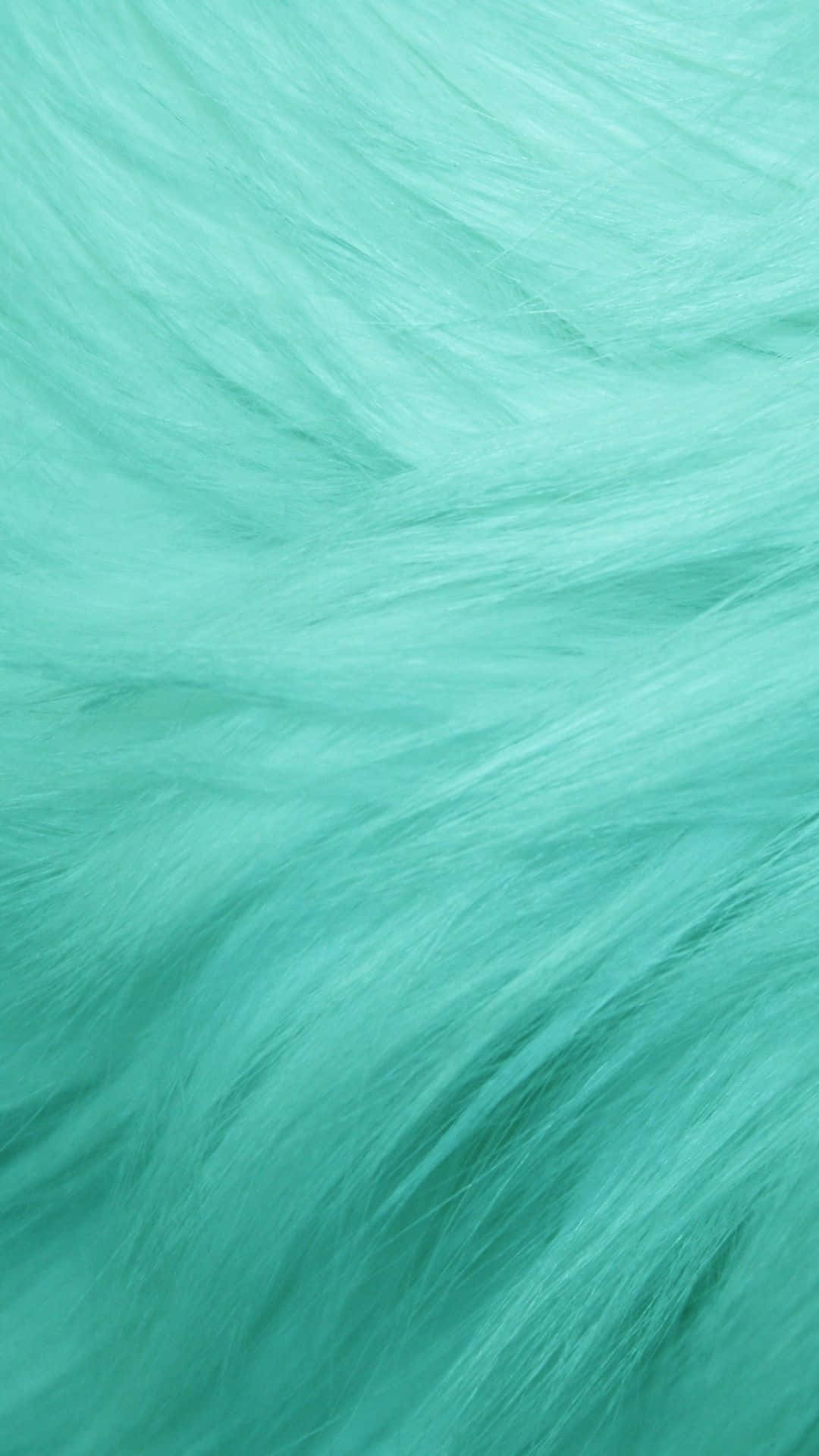 Seafoam Green 桌布 壁紙 — 柔軟流動的藍綠色毛皮，帶有柔和波浪和細微陰影，營造出平靜的觸感質感。