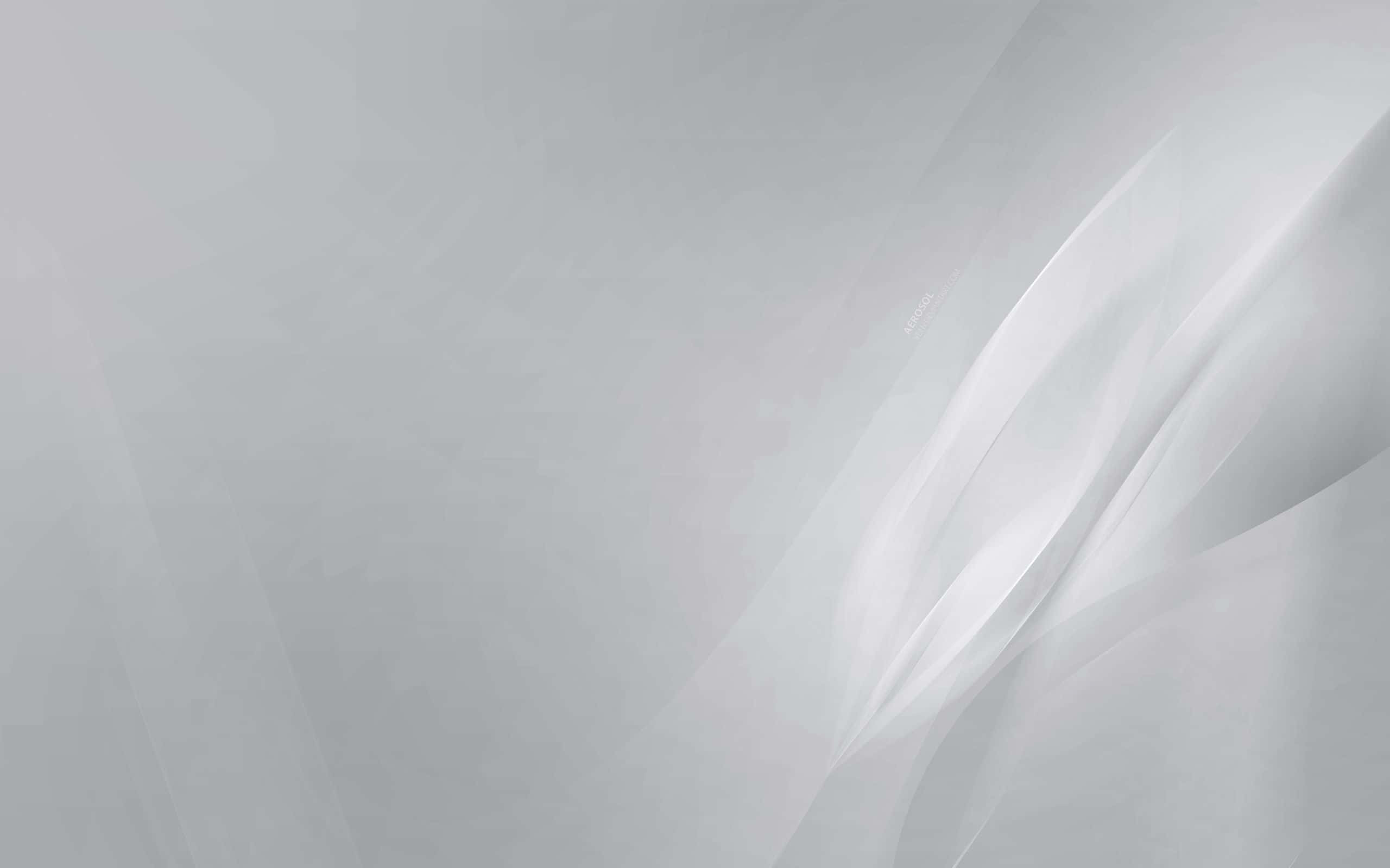 灰色美學 桌布 壁紙 — 柔軟流動的銀色和白色抽象波浪，以柔和的漸變營造出寧靜簡約的背景。