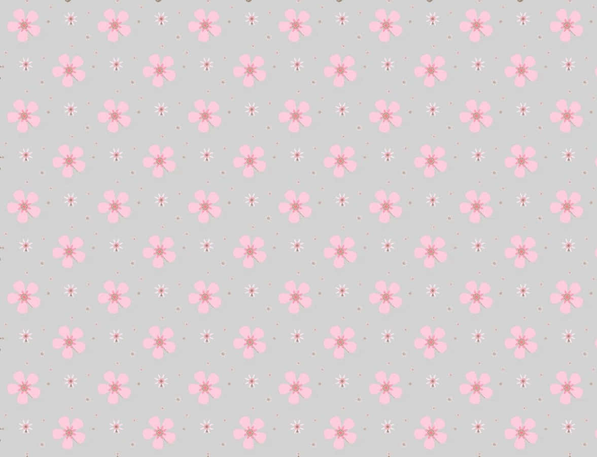 Gray And Pink 桌布 壁紙 — 柔軟灰色牆紙，飾有重複的細膩粉紅花朵和細小白色星爆圖案。