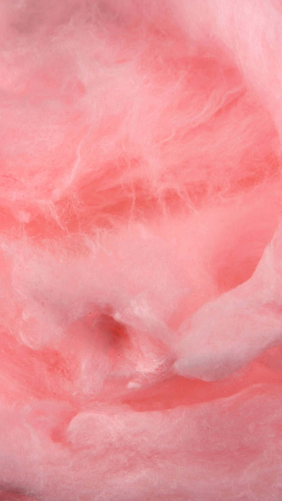 Cotton Candy 桌布 壁紙 — 柔軟蓬鬆的粉紅色棉花糖漩渦，呈現特寫抽象紋理。