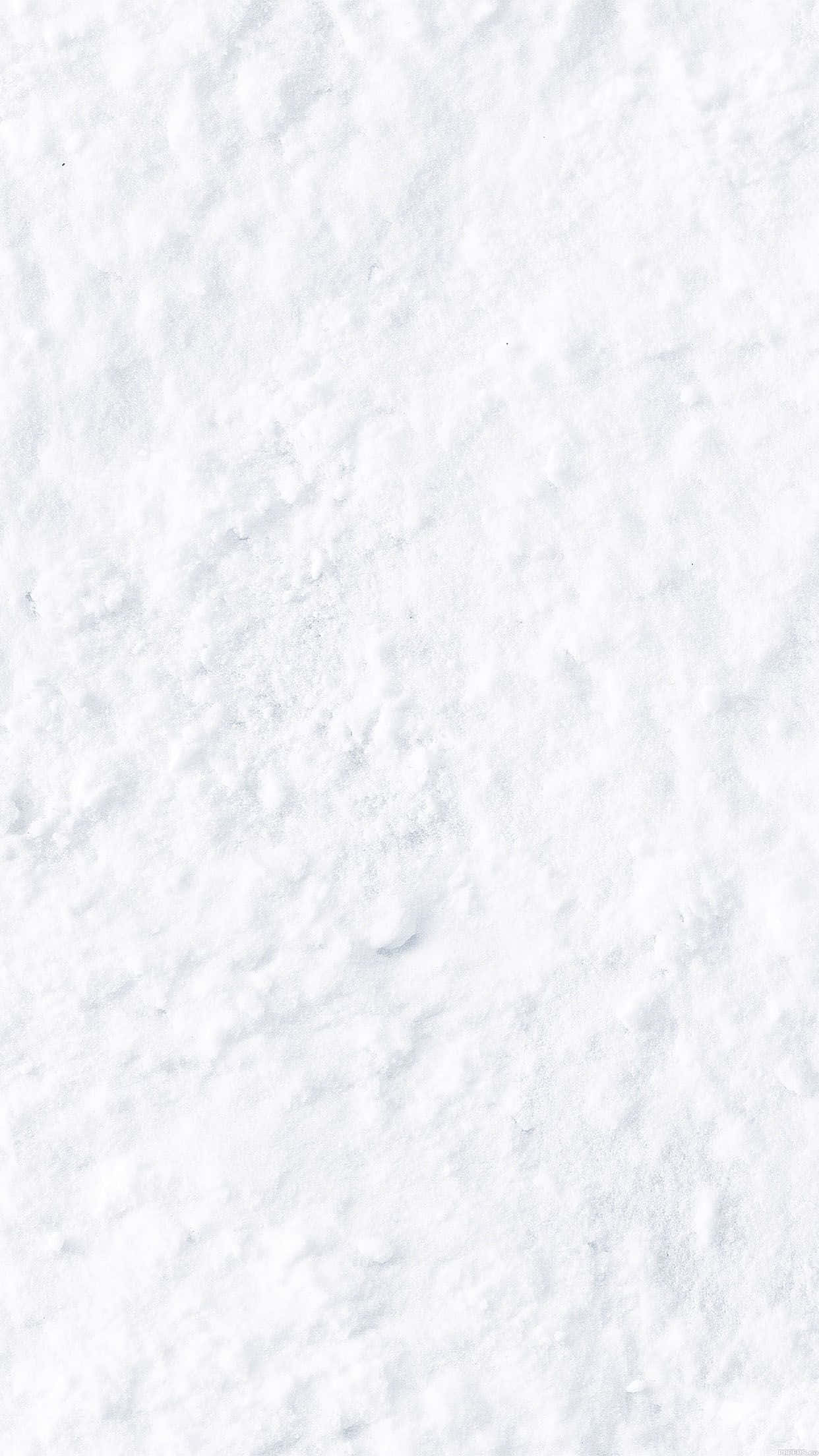 Solid White 桌布 壁紙 — 柔軟質感雪花的特寫，帶有微妙的藍色調和整個畫面的柔和起伏。