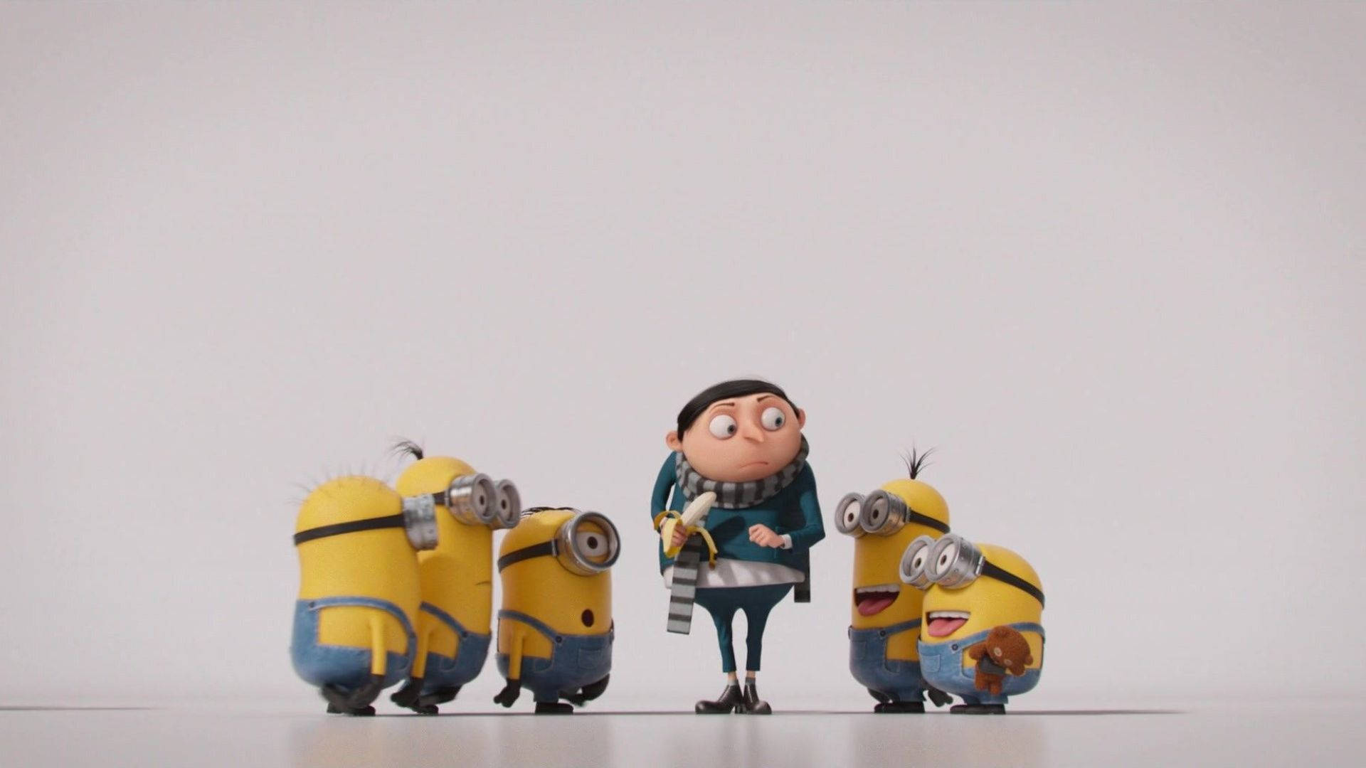 Gru 被四隻Minions包圍在白色工作室中。