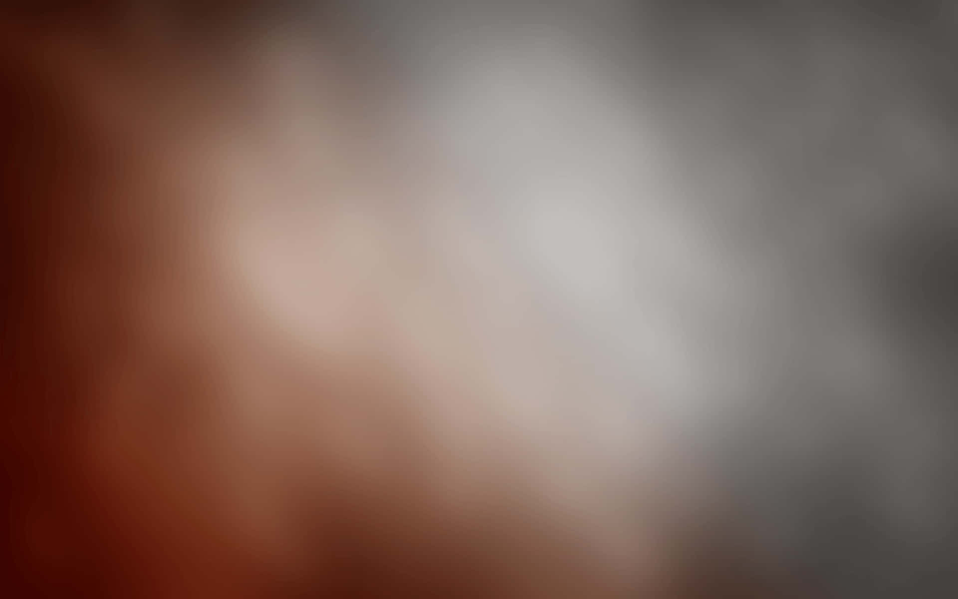 棕灰漸變模糊背景 壁紙 — 柔和漸變，從暖棕色漸變到冷灰色，帶有模糊抽象紋理。