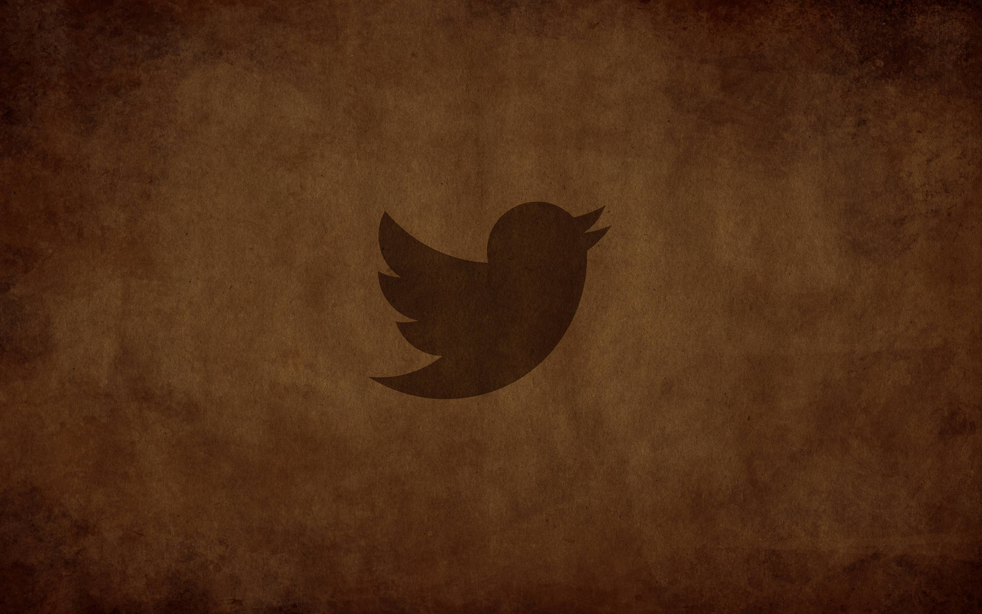 Twitter 鳥標誌在帶紋理的棕色背景上