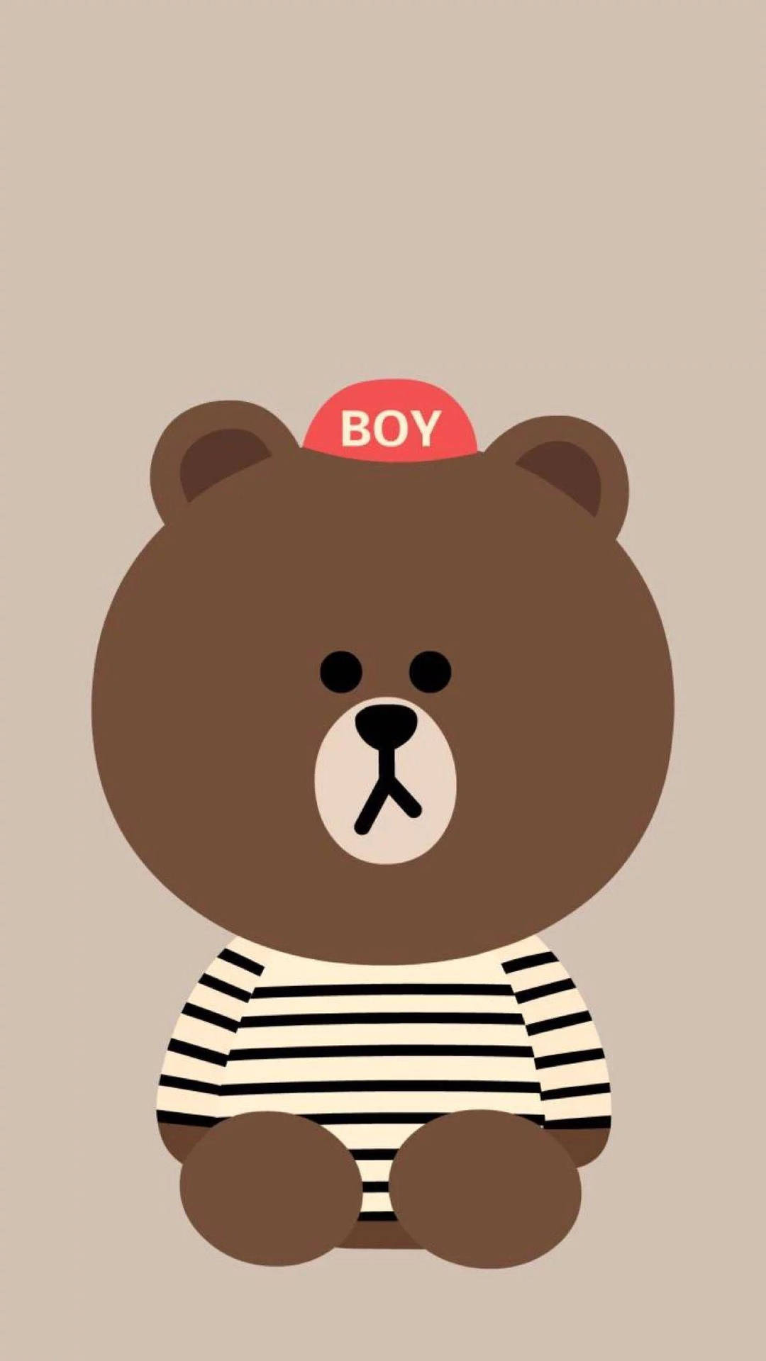 一隻穿著條紋襯衫和紅色帽子、上面寫著BOY的卡通熊。