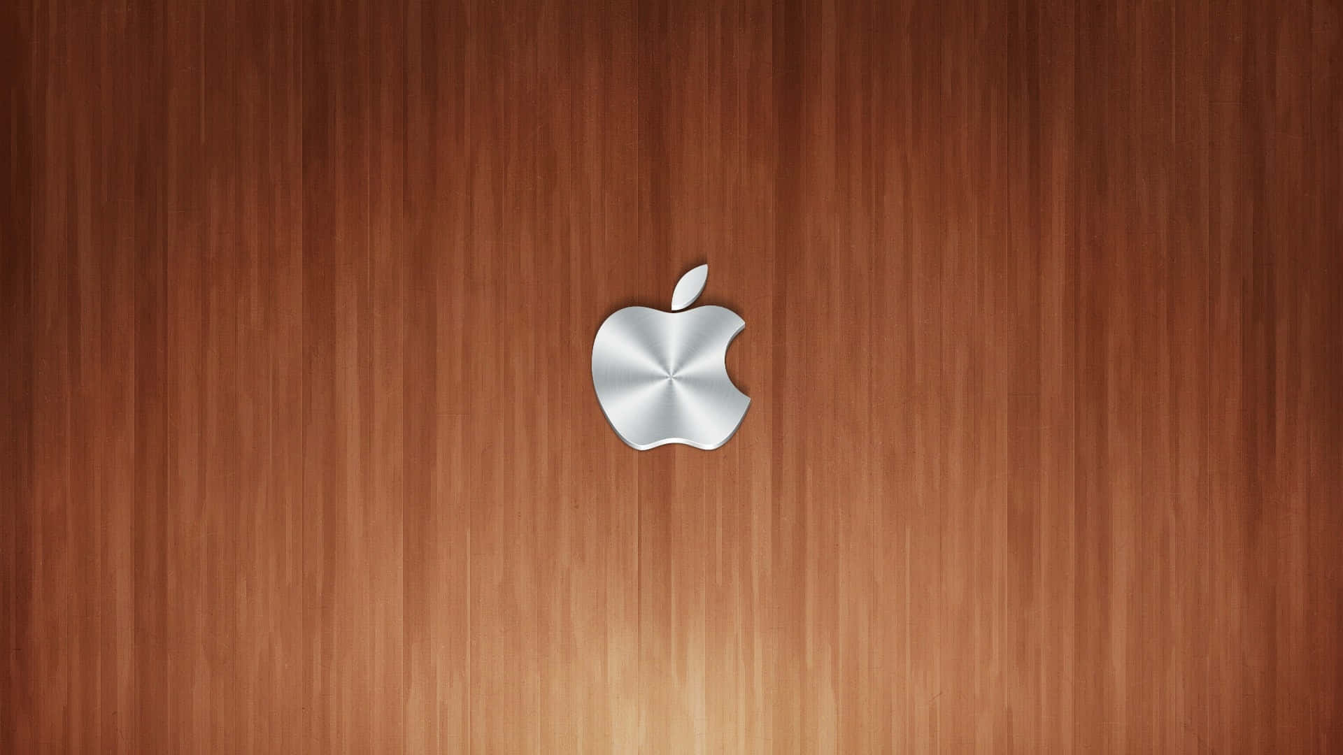 銀色Apple標誌在木紋背景上