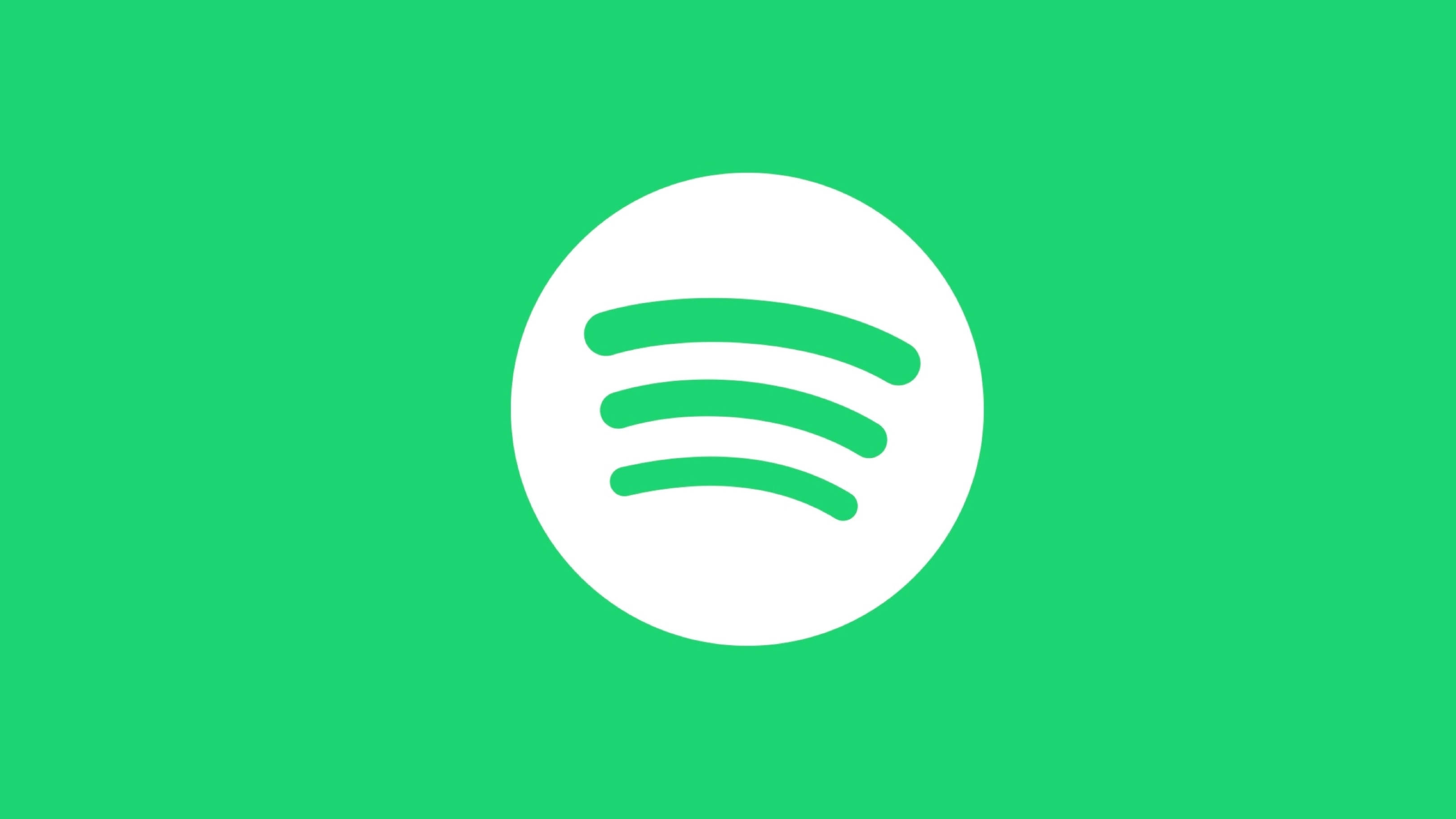 極簡 Spotify 標誌 壁紙 — 一個簡約的Spotify標誌，在純綠色背景上，白色圓圈內有三條綠色曲線。