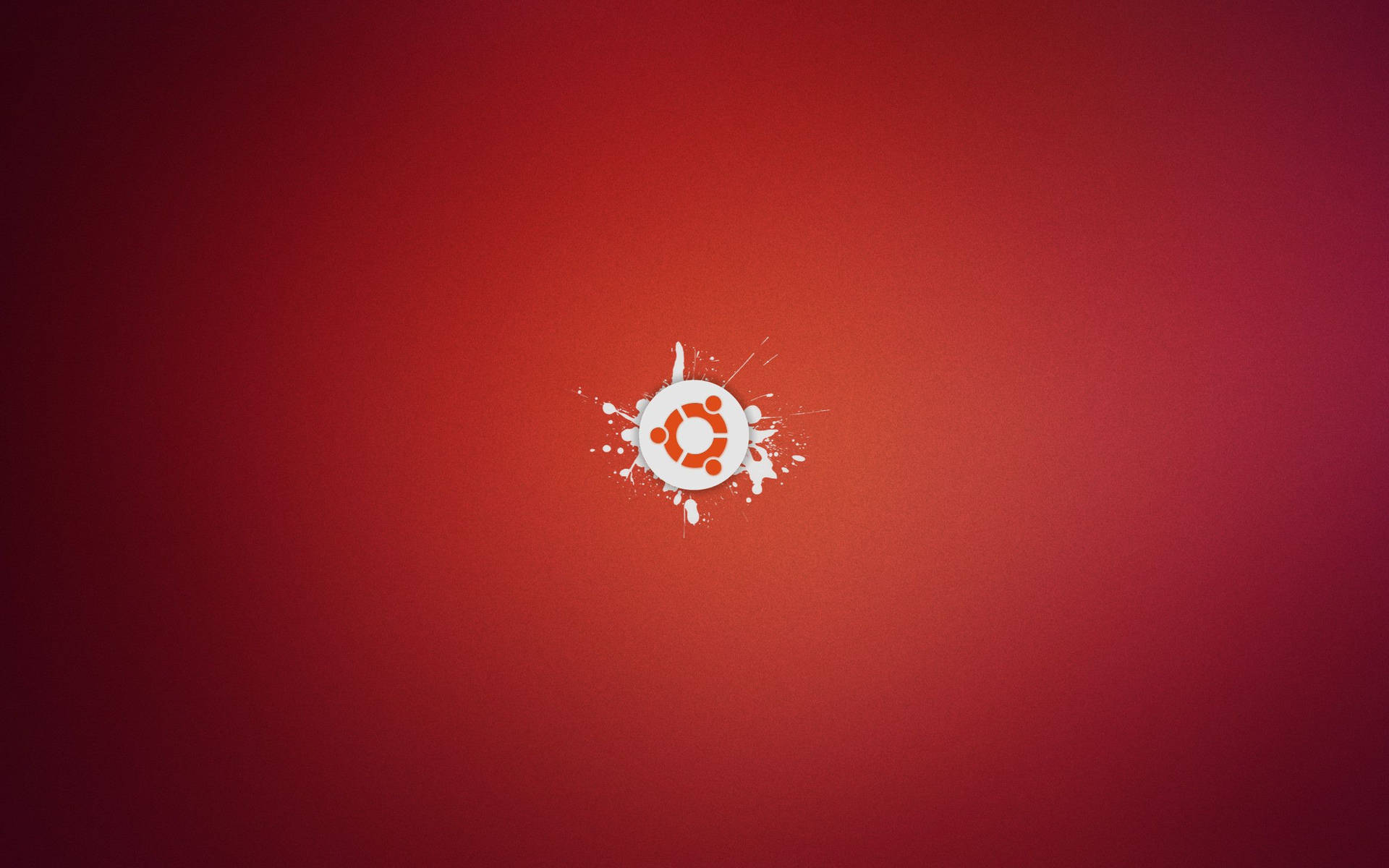 Ubuntu 標誌在紅色漸變背景上帶有白色油漆飛濺