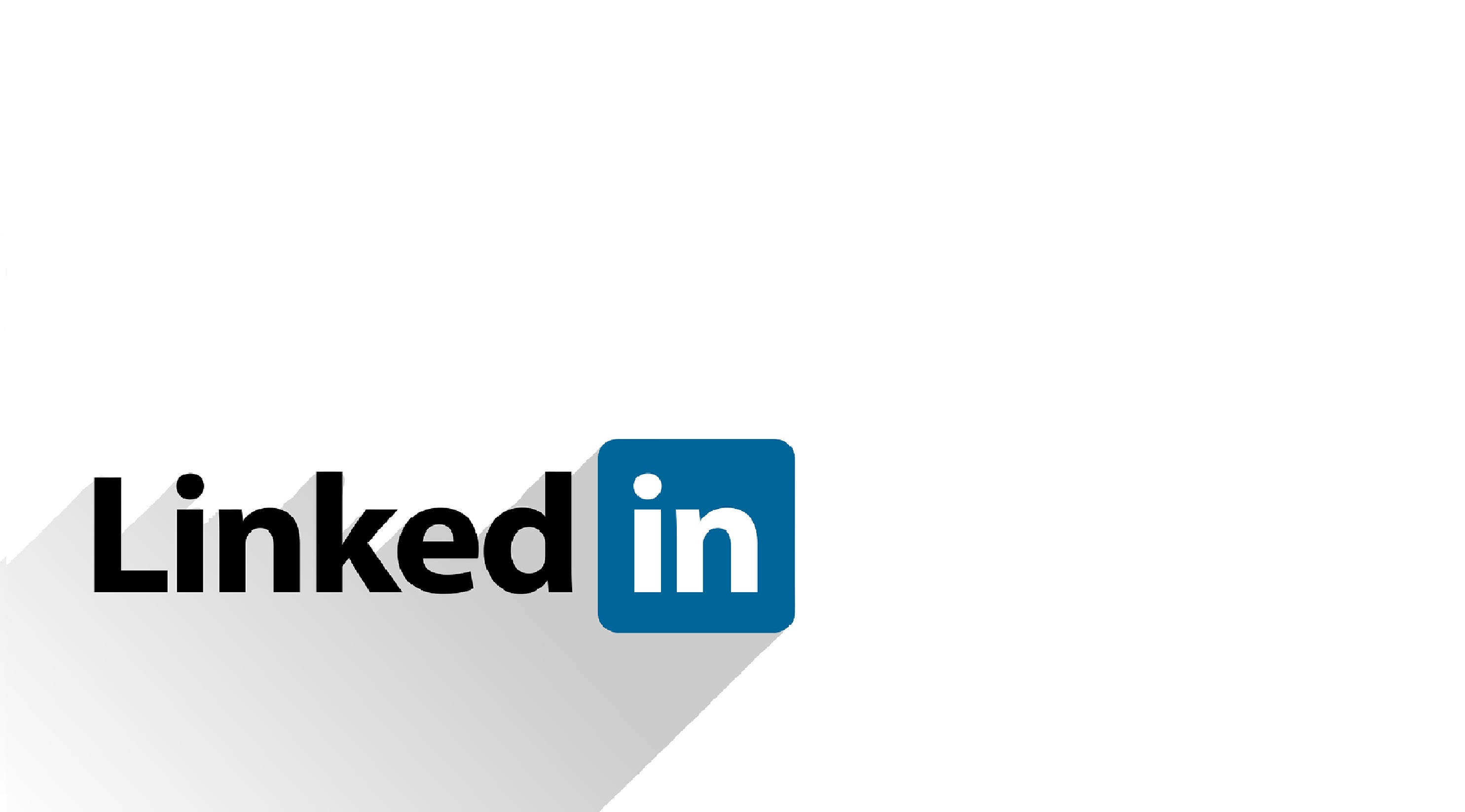 極簡LinkedIn平台標誌 壁紙 — LinkedIn 標誌，帶有粗體黑色文字和藍色方形圖標，在白色背景上投射出長長的陰影。