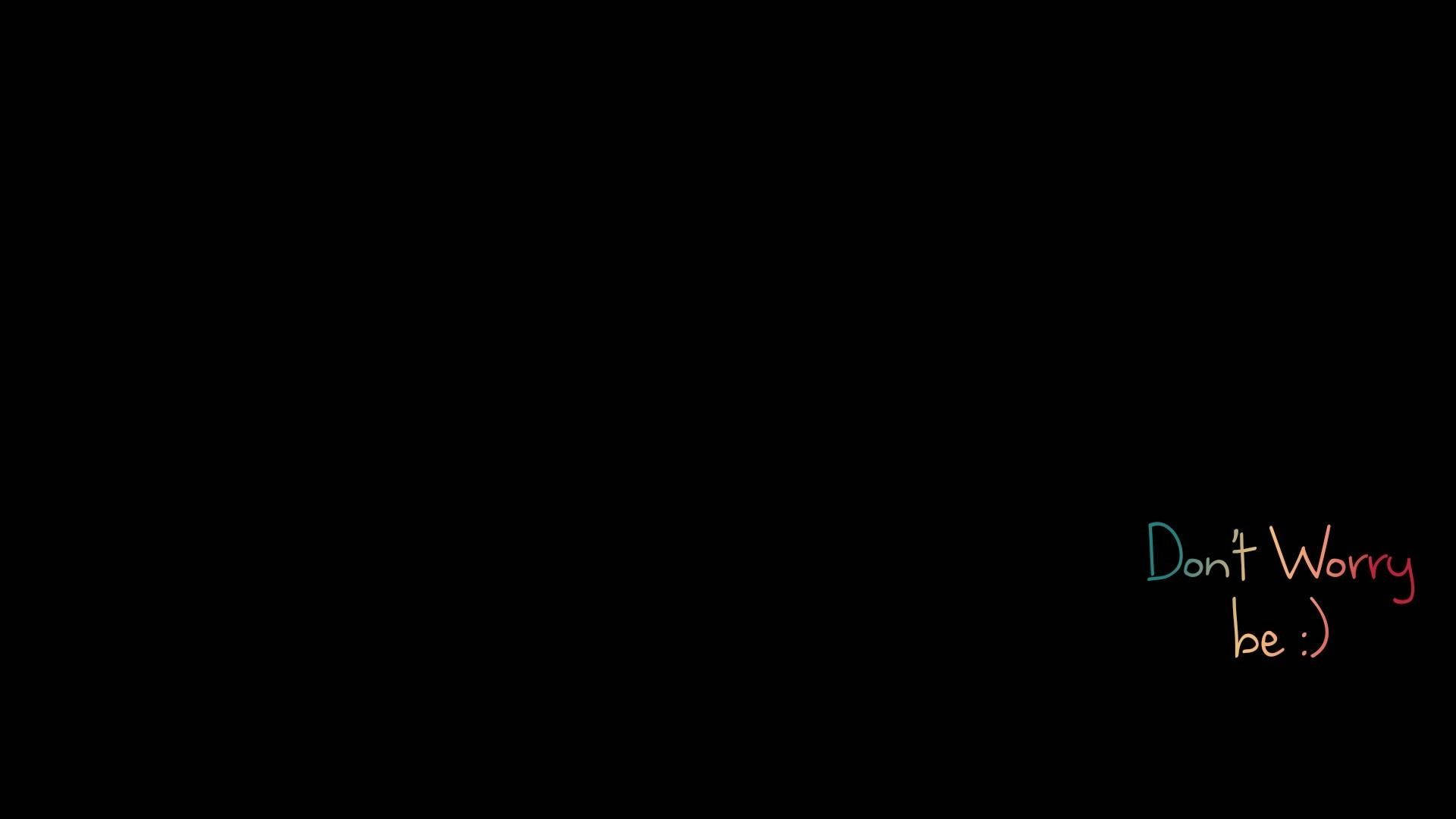 彩色手寫文字在黑色背景上寫著「Don't Worry be :)」。