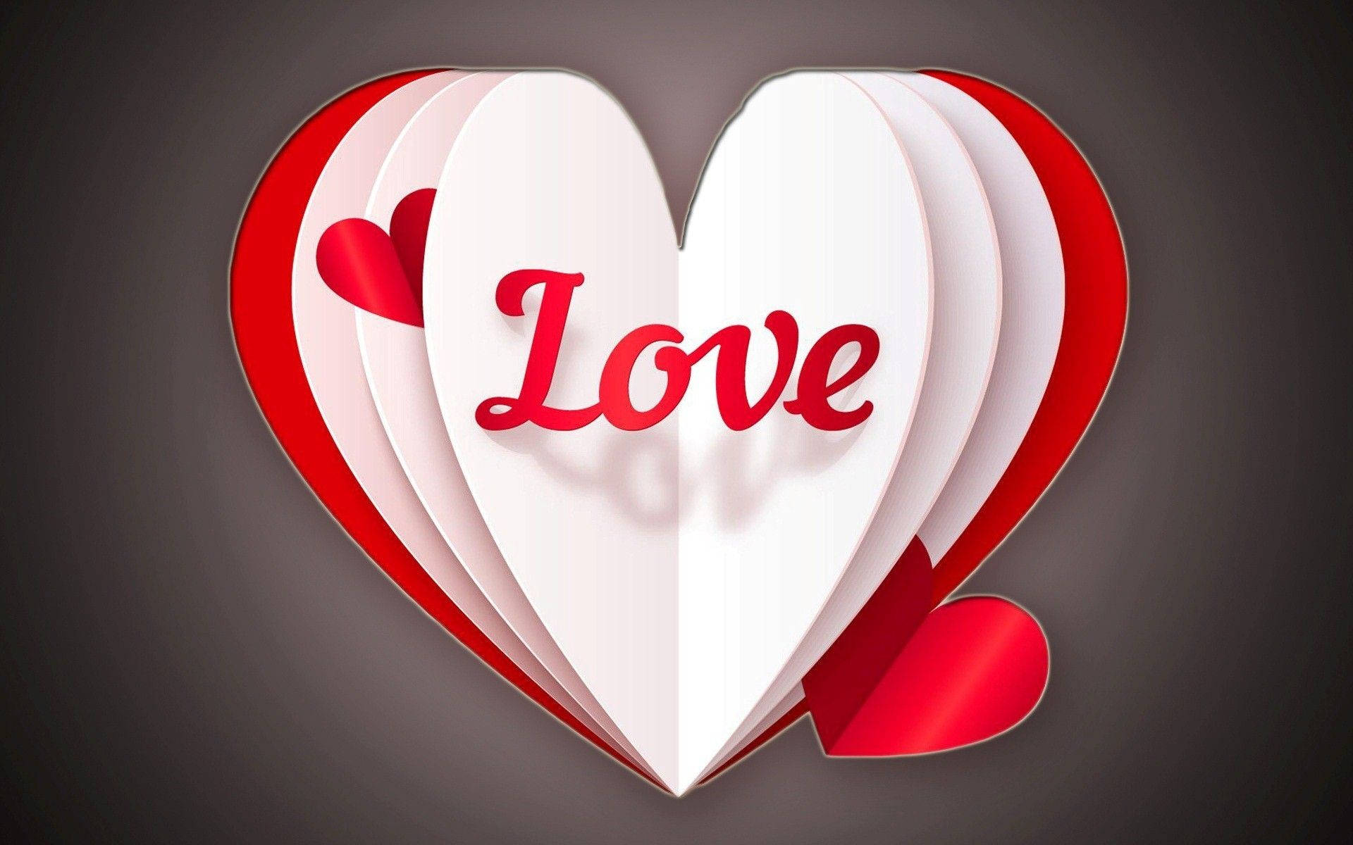 極簡愛心藝術 壁紙 — 一個3D紙心心，帶有紅色「Love」文字和細小心心，層疊在深灰色背景上。