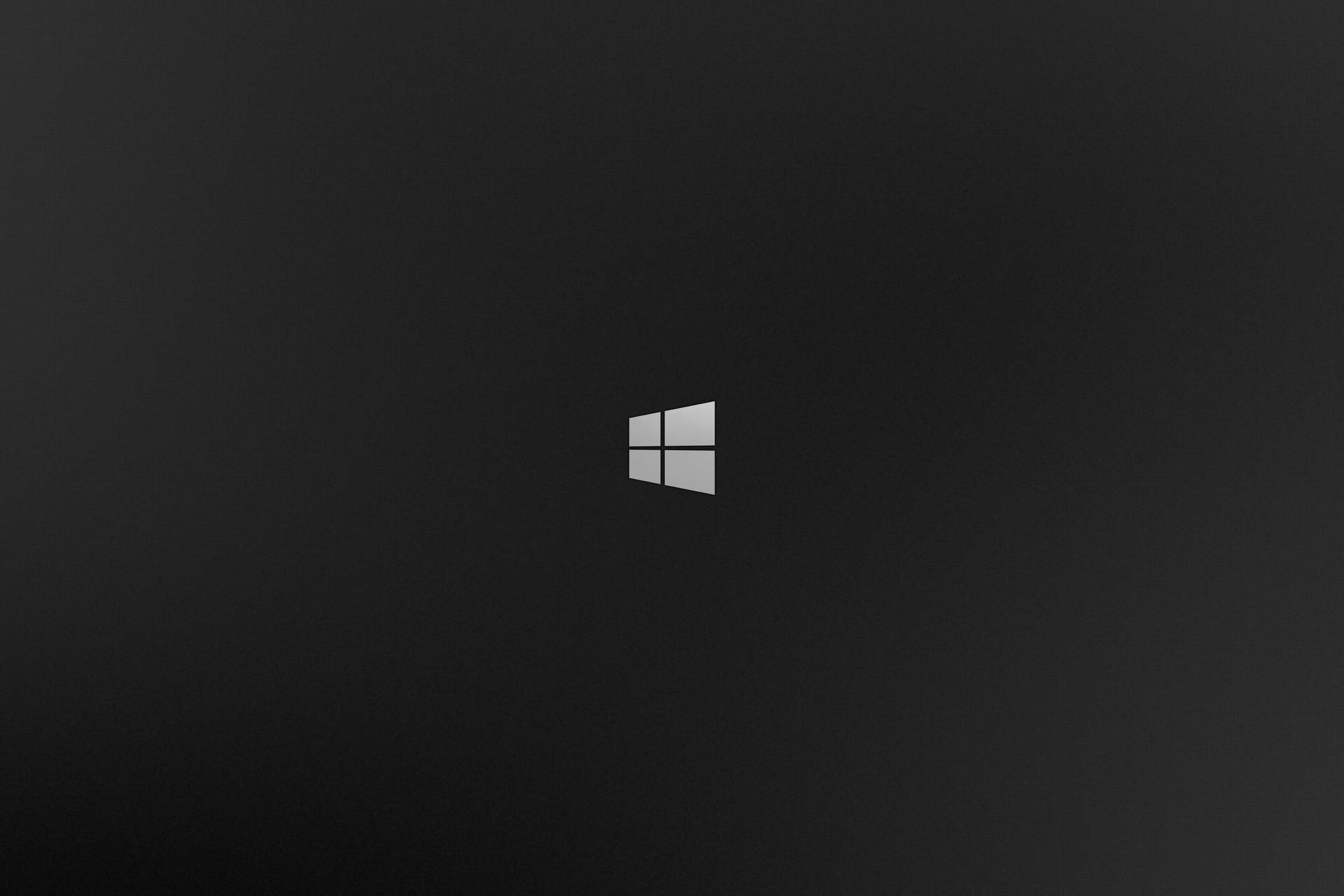 Windows標誌置於深色漸變背景中央