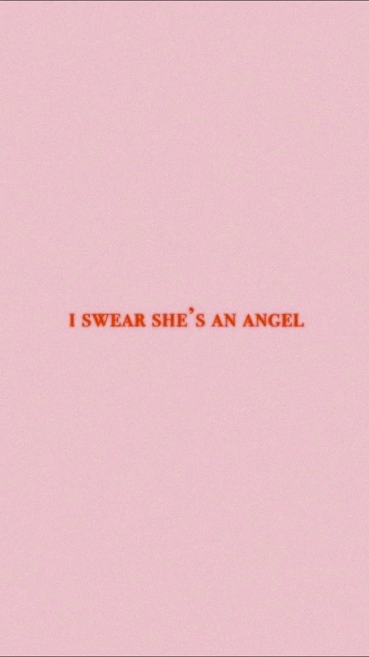 語錄 桌布 壁紙 — 極簡粉色背景，中央紅色文字寫著 i swear she's an angel。