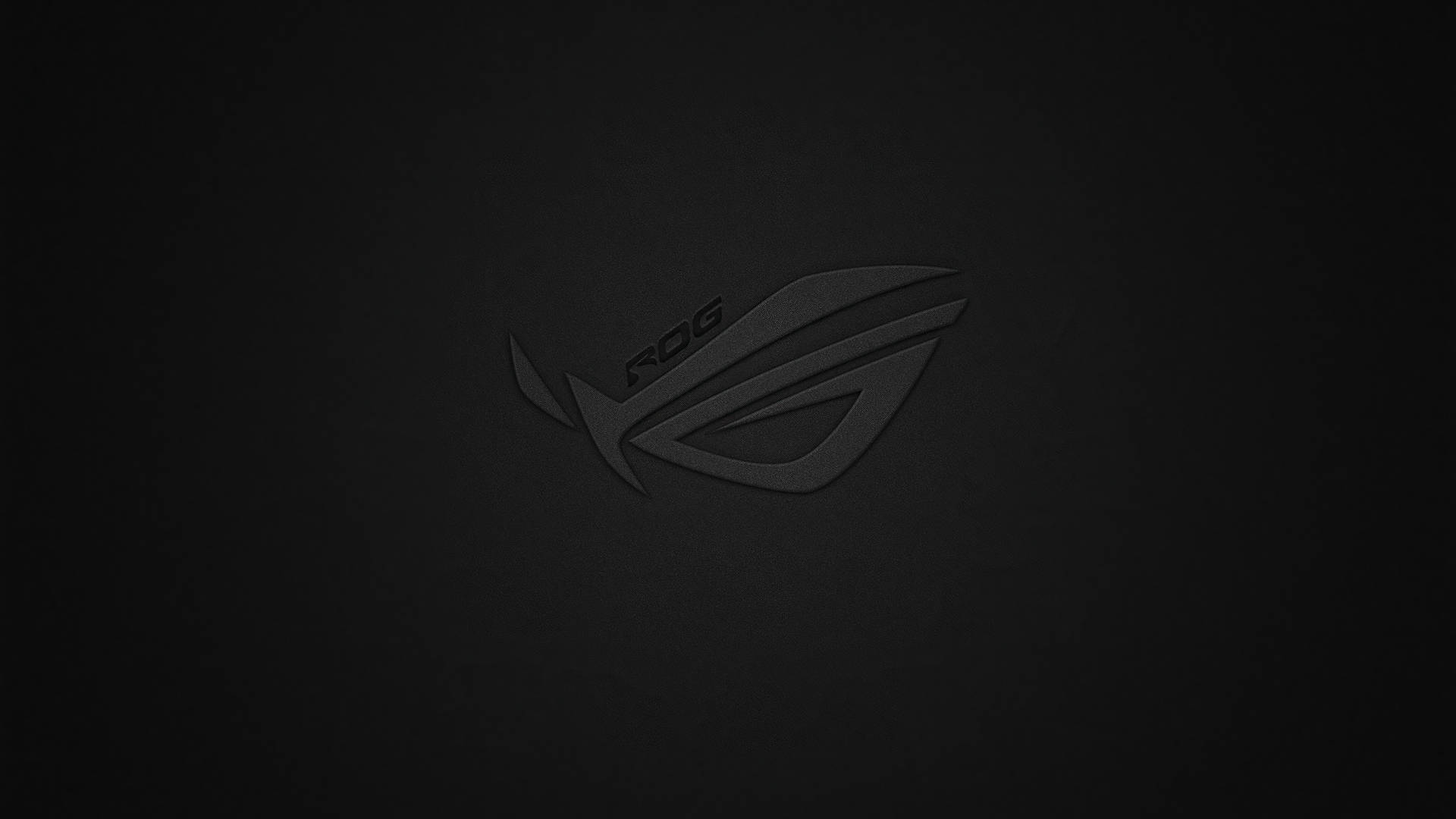 帶有紋理的黑色背景上的深色 ROG 遊戲標誌