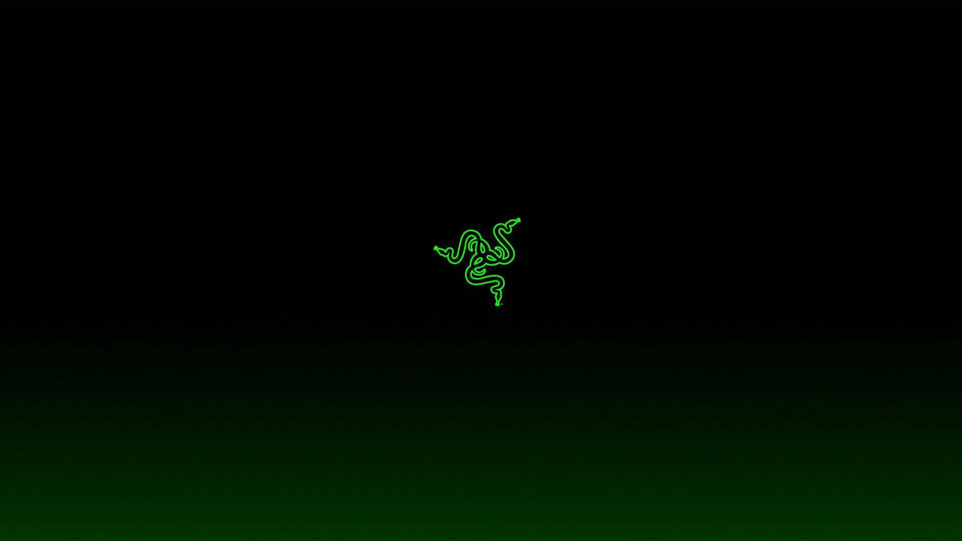 暗色漸變背景上的發光綠色Razer標誌