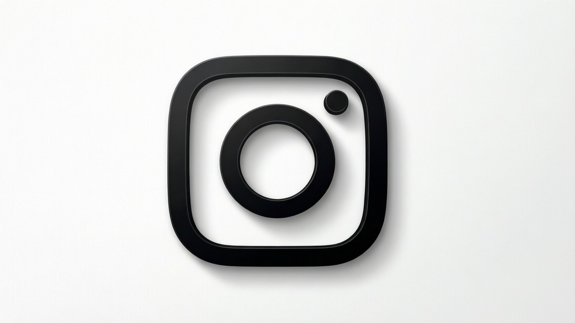 極簡黑Instagram標誌 壁紙 — 一個極簡的黑色Instagram標誌，居中於乾淨的白色背景上，帶有柔和陰影。
