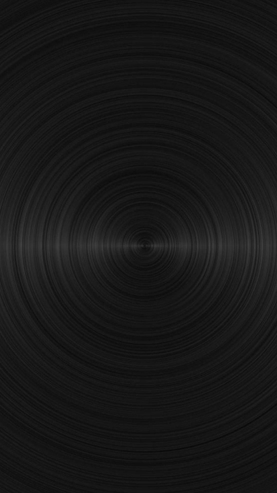 simple dark aesthetic 桌布 壁紙 — 極簡黑色壁紙，帶有從中心點向外輻射的同心圓凹槽。