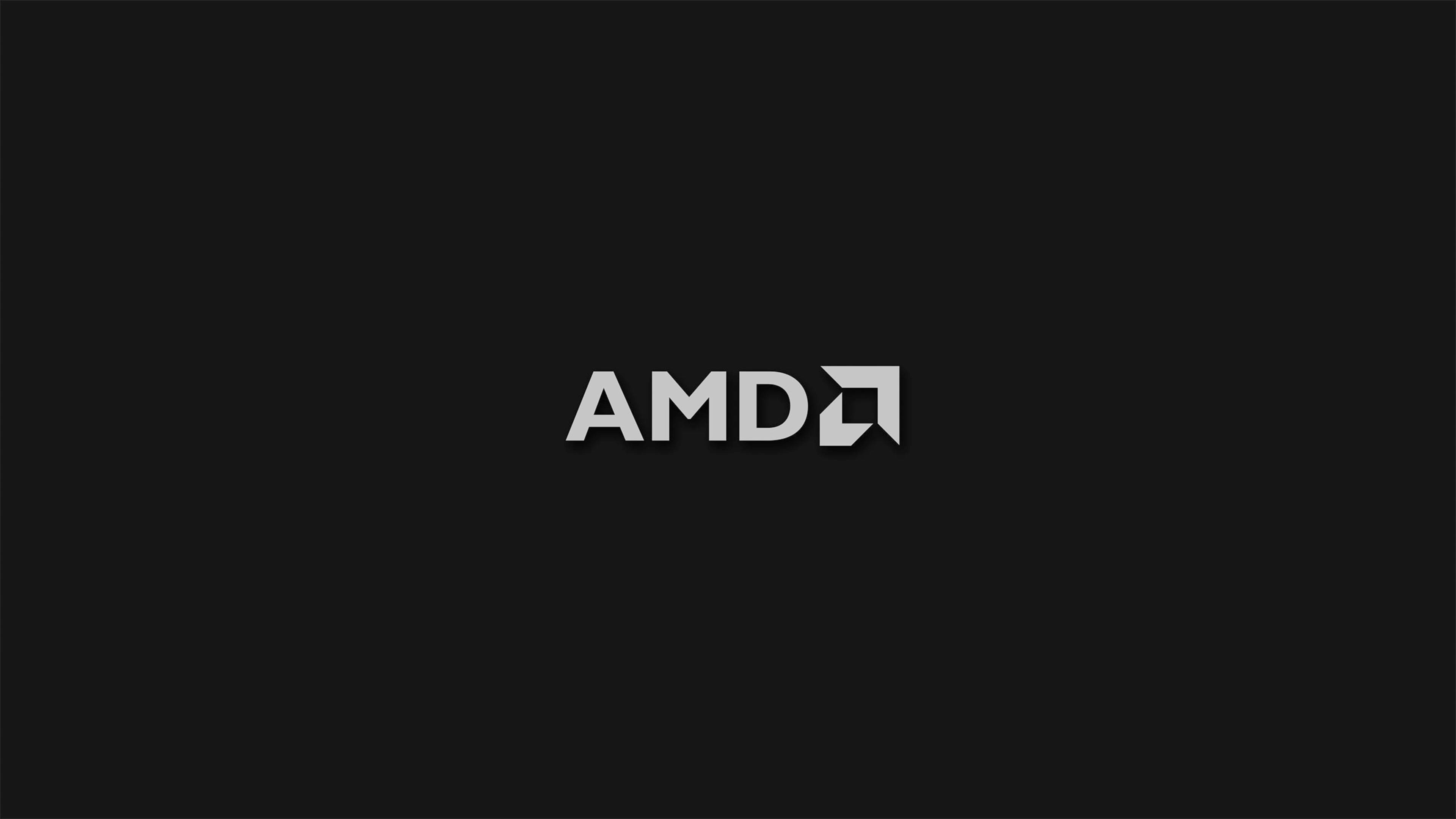 4K 桌布 壁紙 — 極簡黑色背景，白色AMD標誌居中，邊緣乾淨銳利。