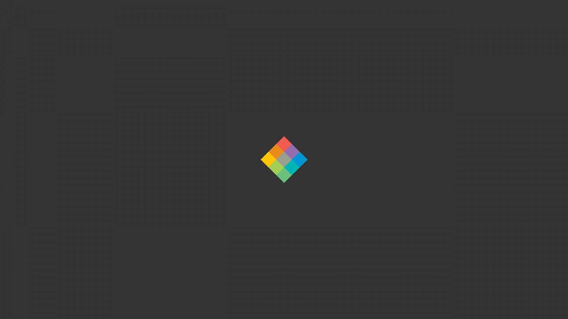 極致簡約之美 —— 1080p 極簡顯示 壁紙 — 一個色彩繽紛的鑽石標誌，置於帶有細微網格圖案的深灰色背景中央。