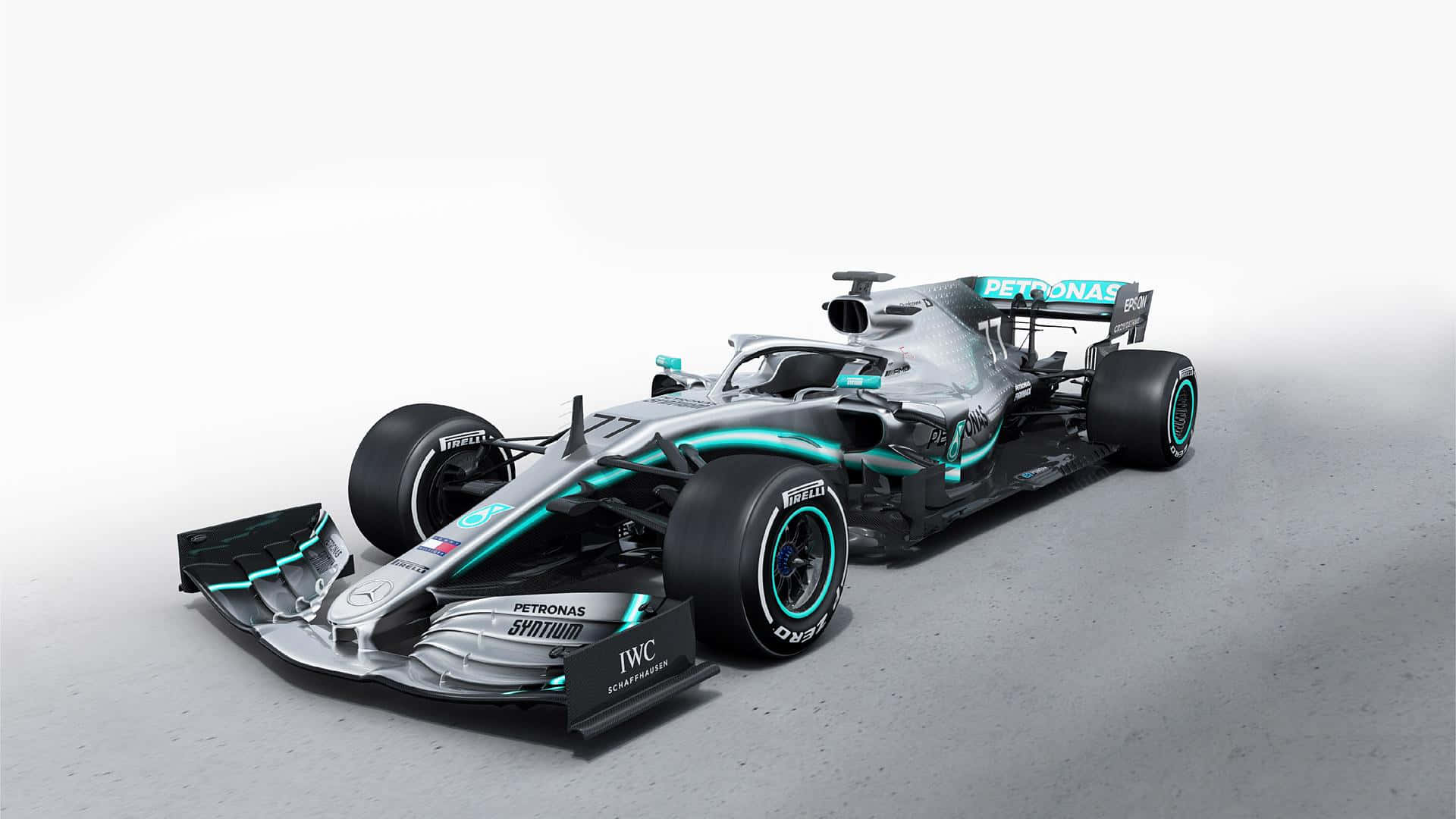 攝影棚中帶有Petronas品牌標誌的銀色和藍綠色一級方程式賽車。