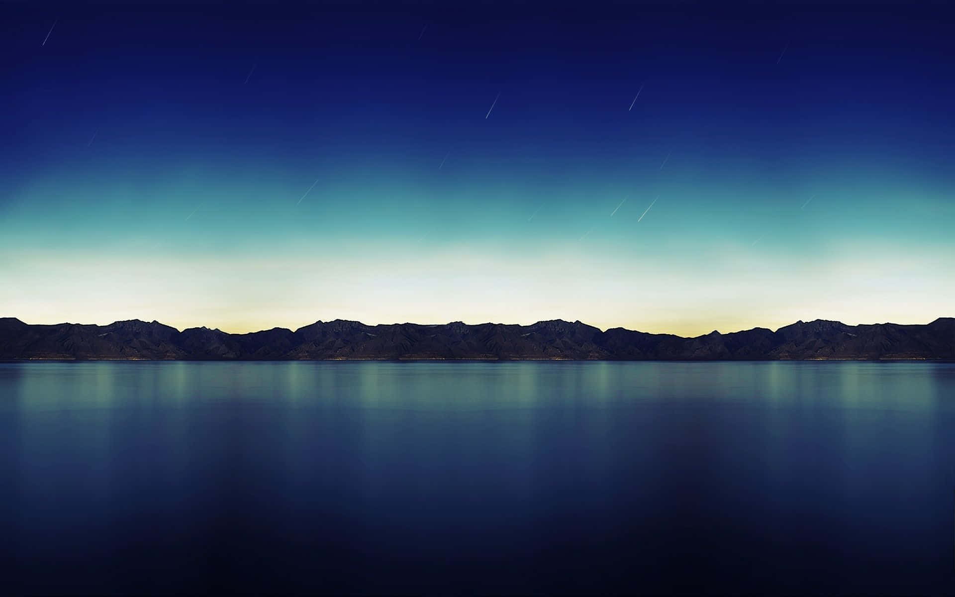 標準 iPad 首頁背景 壁紙 — 寧靜的暮色湖泊在星空下映照著遠山，帶有柔和的藍色和青綠色漸變。