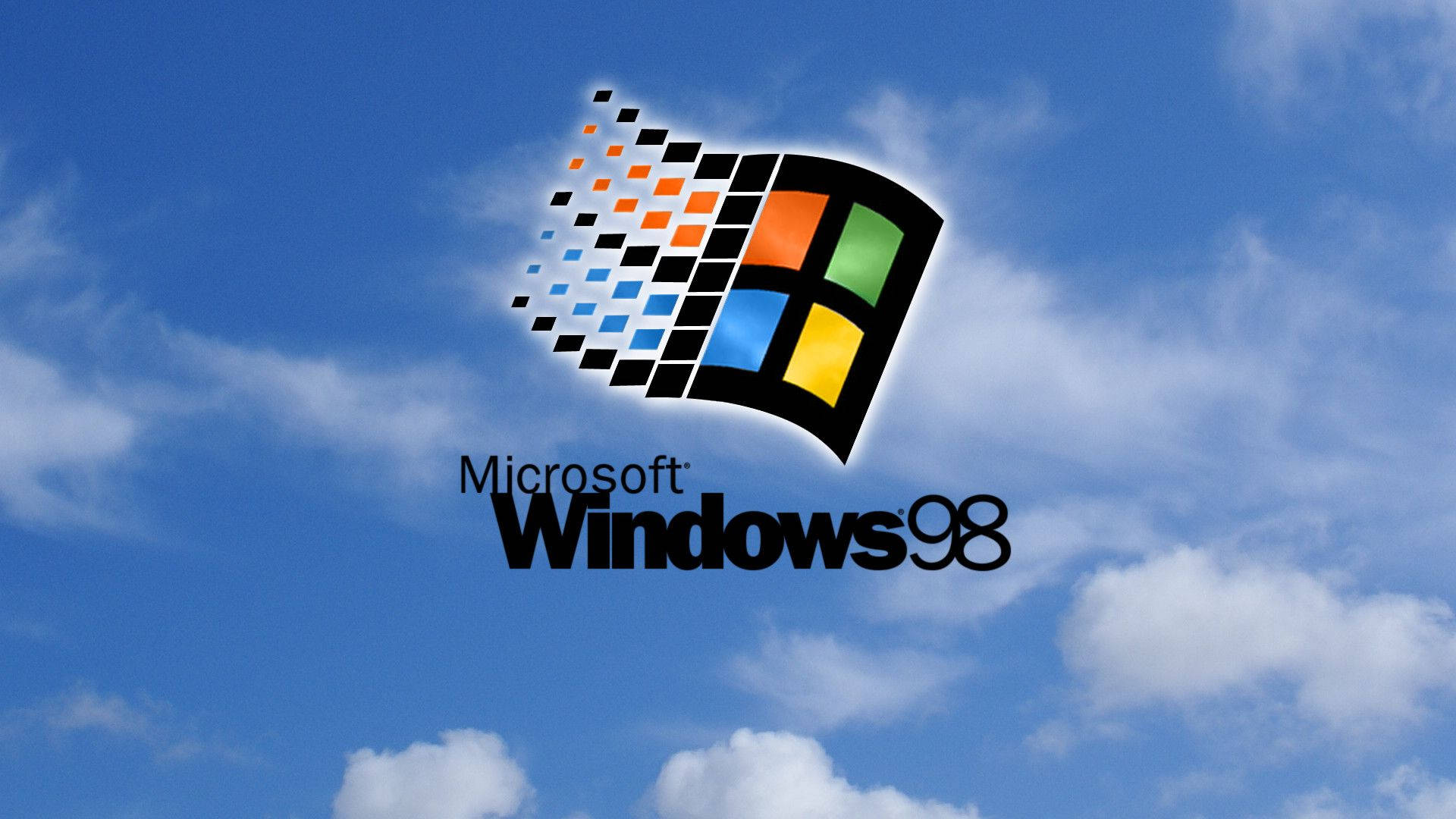 Microsoft Windows 95 壁紙 — 標誌性的 Windows 98 標誌漂浮在明亮的藍天和白雲之間。