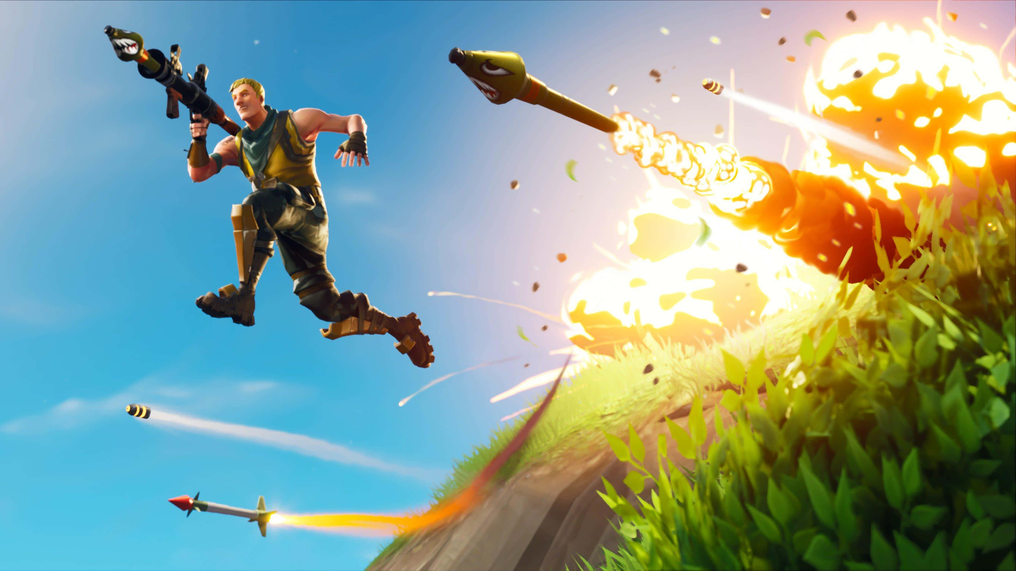 標題：笑到不行：《Fortnite》經典失敗與搞笑瞬間 壁紙 — 一個Fortnite角色跳躍在空中發射火箭炮，身後在青翠山丘上爆炸四起，天空湛藍明亮。