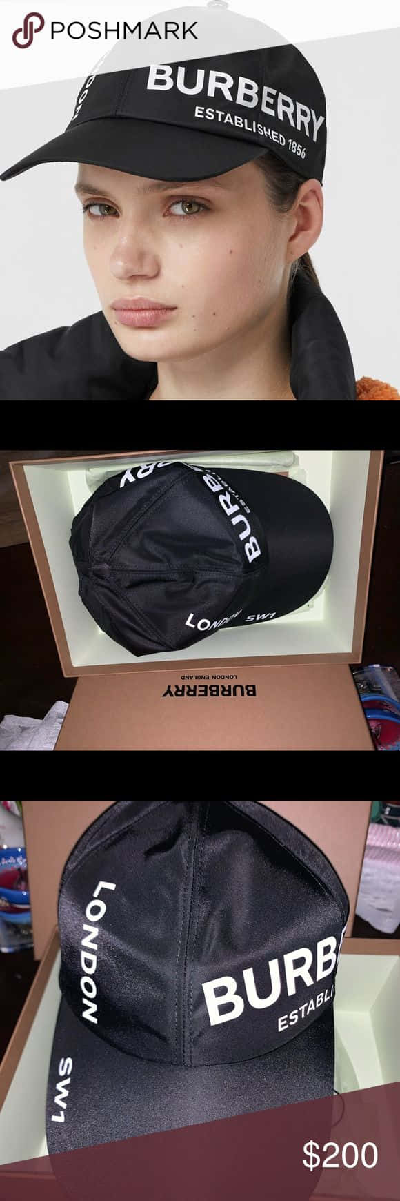 模特身穿經典Burberry風衣 壁紙 — 模特兒戴著一頂帶有白色品牌標誌的黑色Burberry帽子，同時帽子也展示在其品牌盒子中。