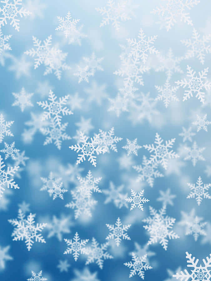 雪花在清涼的藍天中飄落