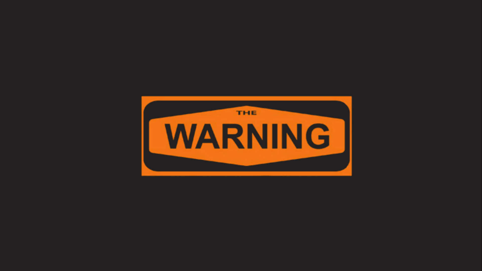 一個警告標誌，橙色背景，黑色文字寫著「THE WARNING」。