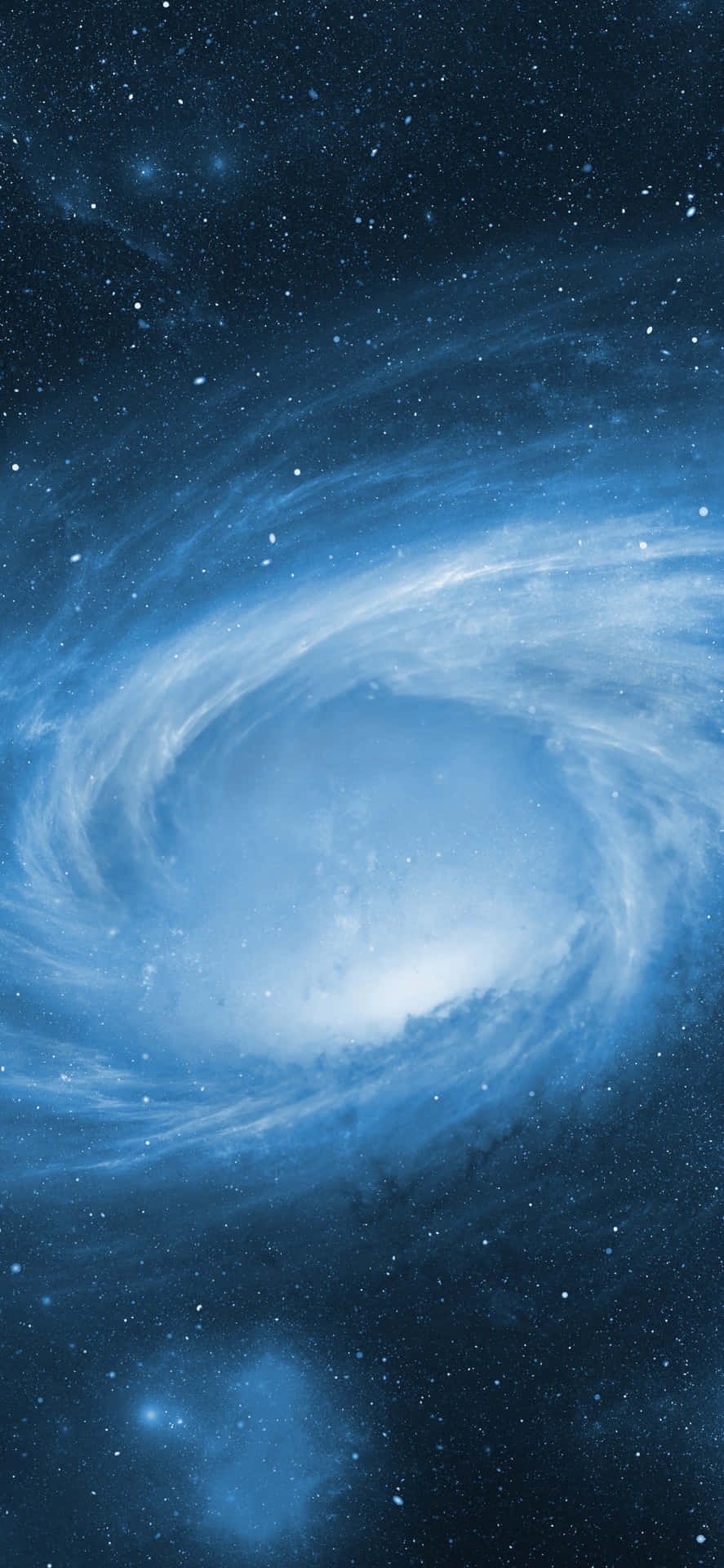 一個充滿星星和發光宇宙雲的旋轉藍色螺旋星系。