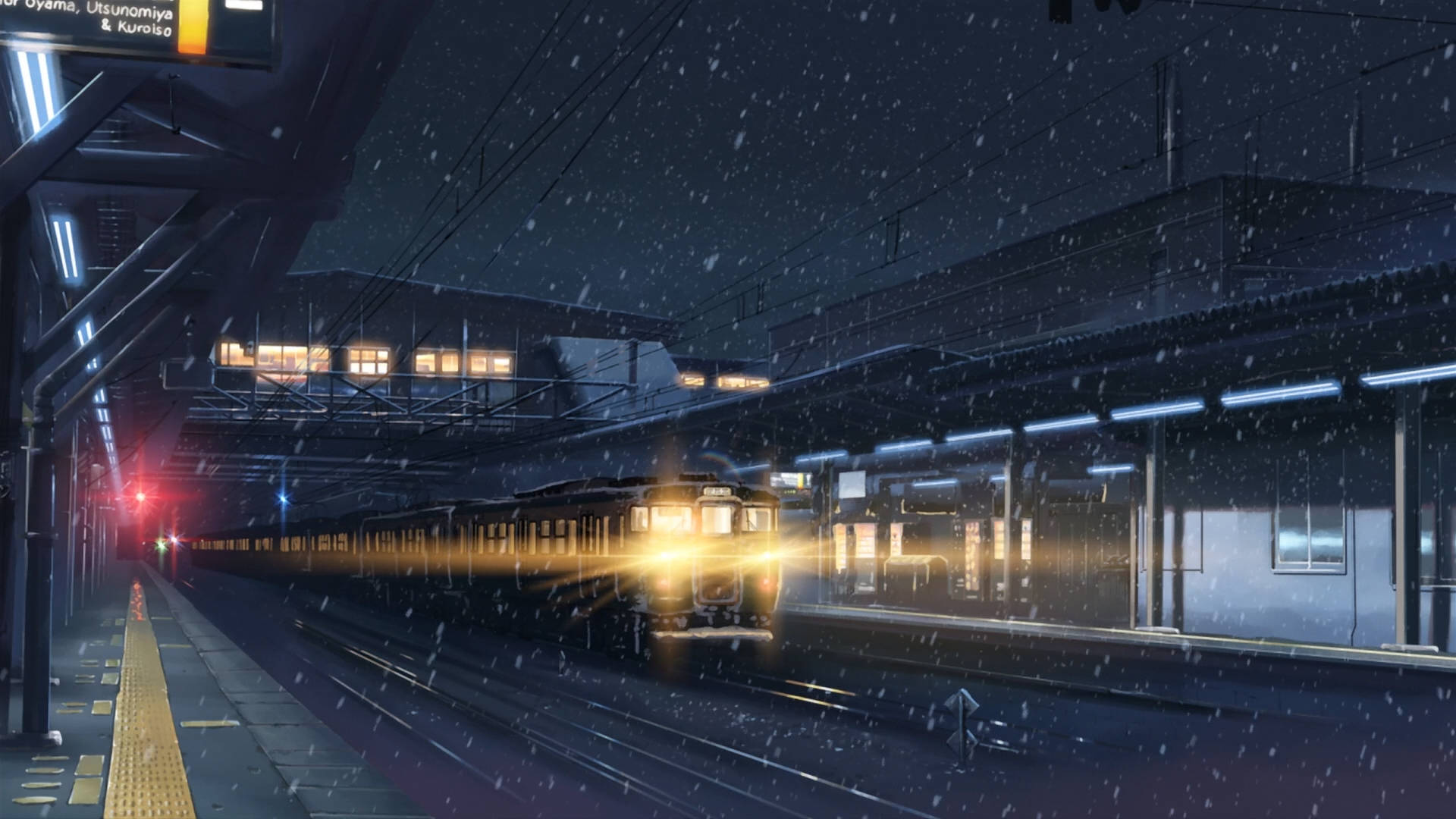 火車在夜間雪站疾馳，帶有發光頭燈和飄落的雪花。