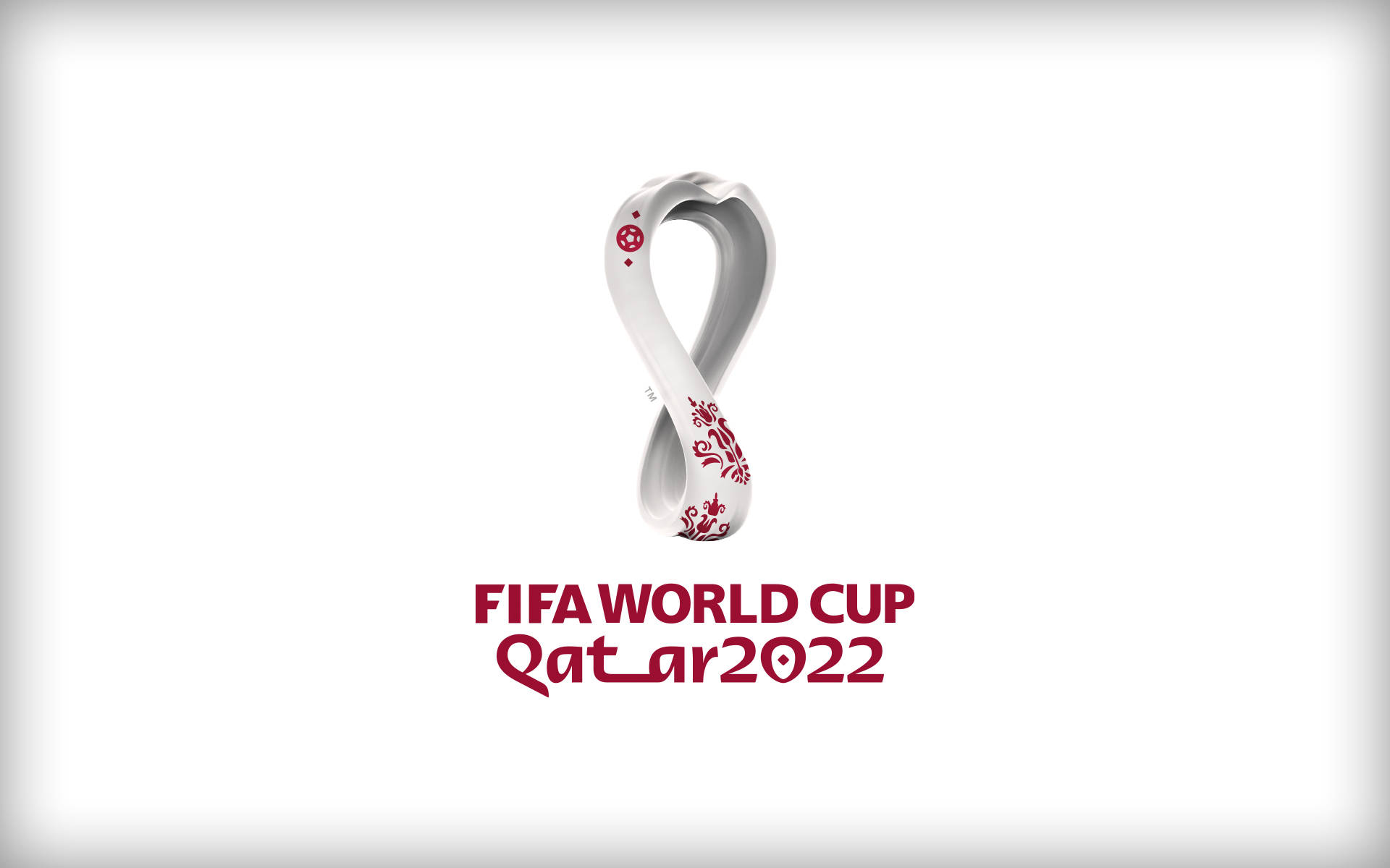 FIFA 世界盃卡塔爾 2022 標誌，帶有無限符號和紅色花卉設計。