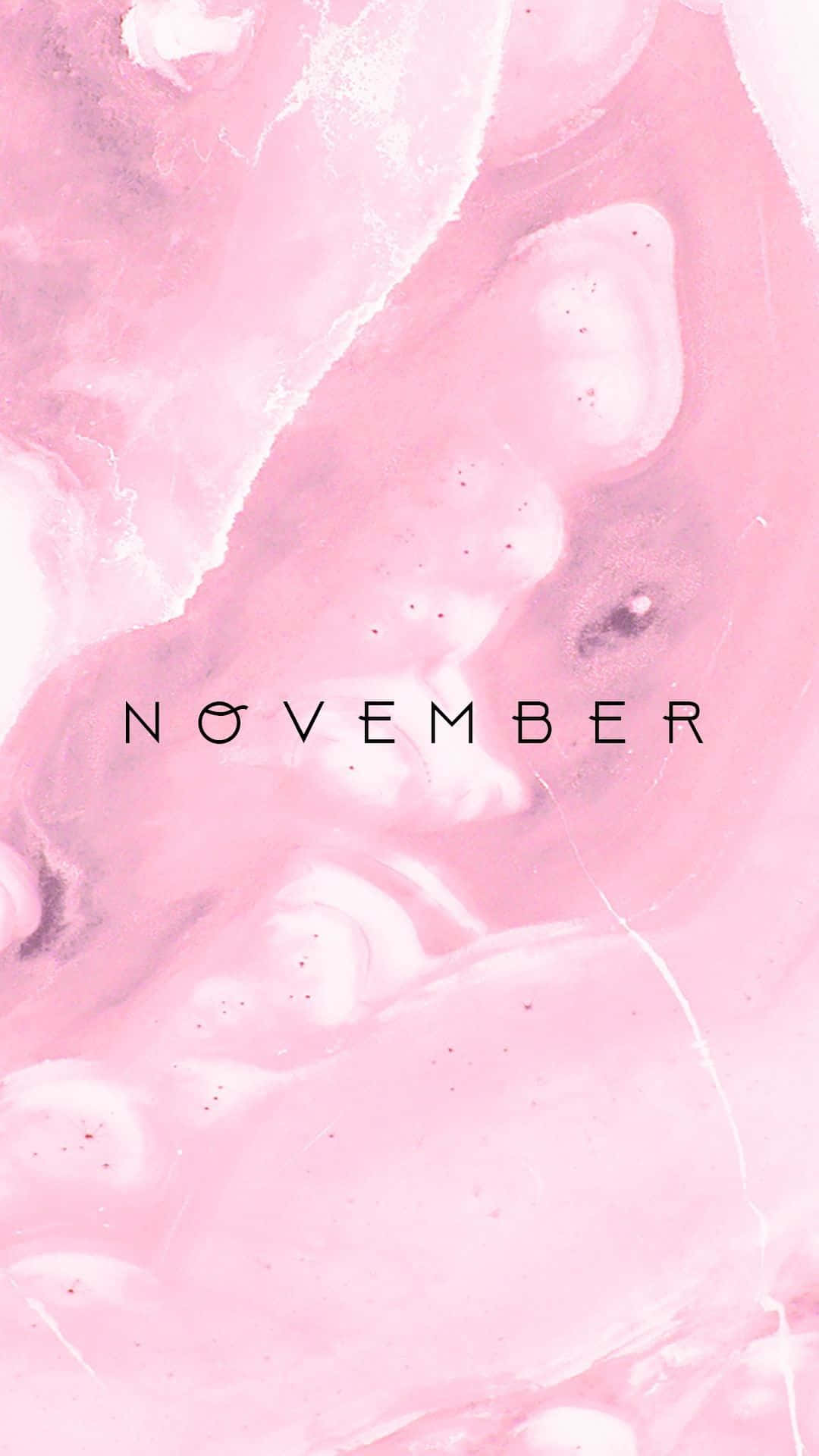 粉紅色和白色大理石紋理，帶有黑色文字的「november」。