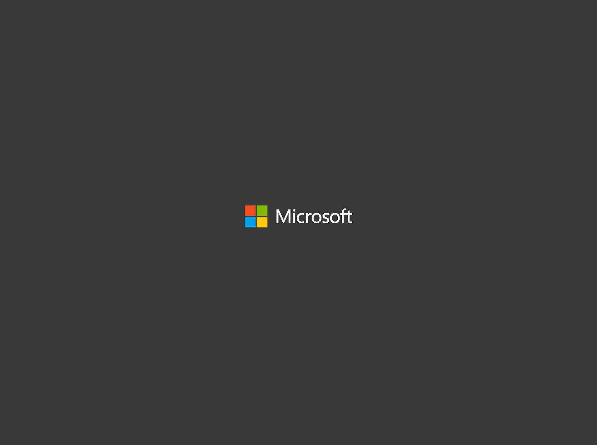 Microsoft 標誌，深灰色背景上有四個彩色方塊