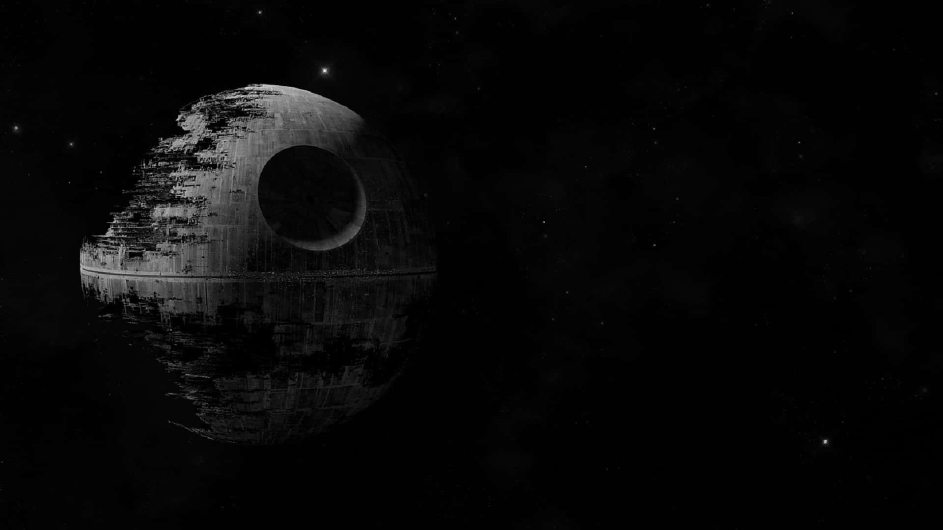 Naboo 桌布 壁紙 — 死星在佈滿星星的虛空中威脅性地浮現，呈現出鮮明的黑白太空場景。